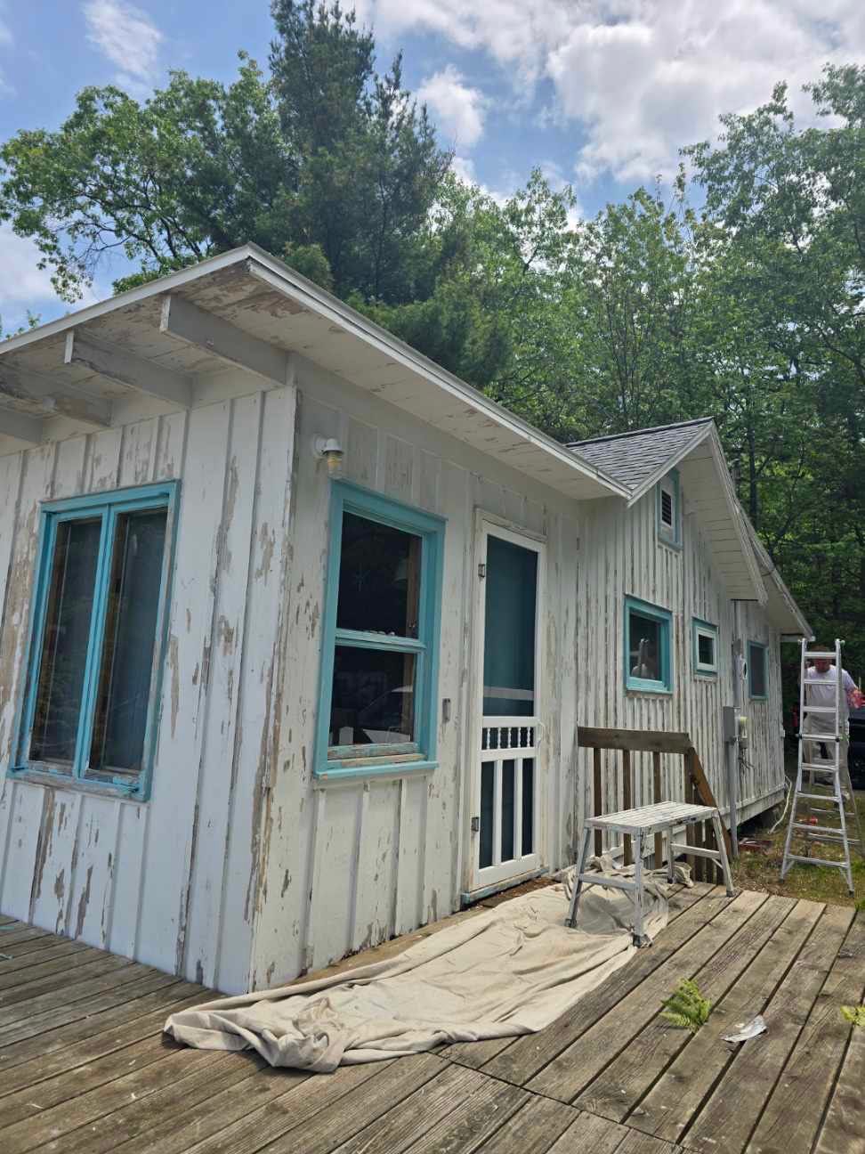 Lakeside Cottage Exterior Painting and Teal Trim Restoration in Mears by Gordon Painting