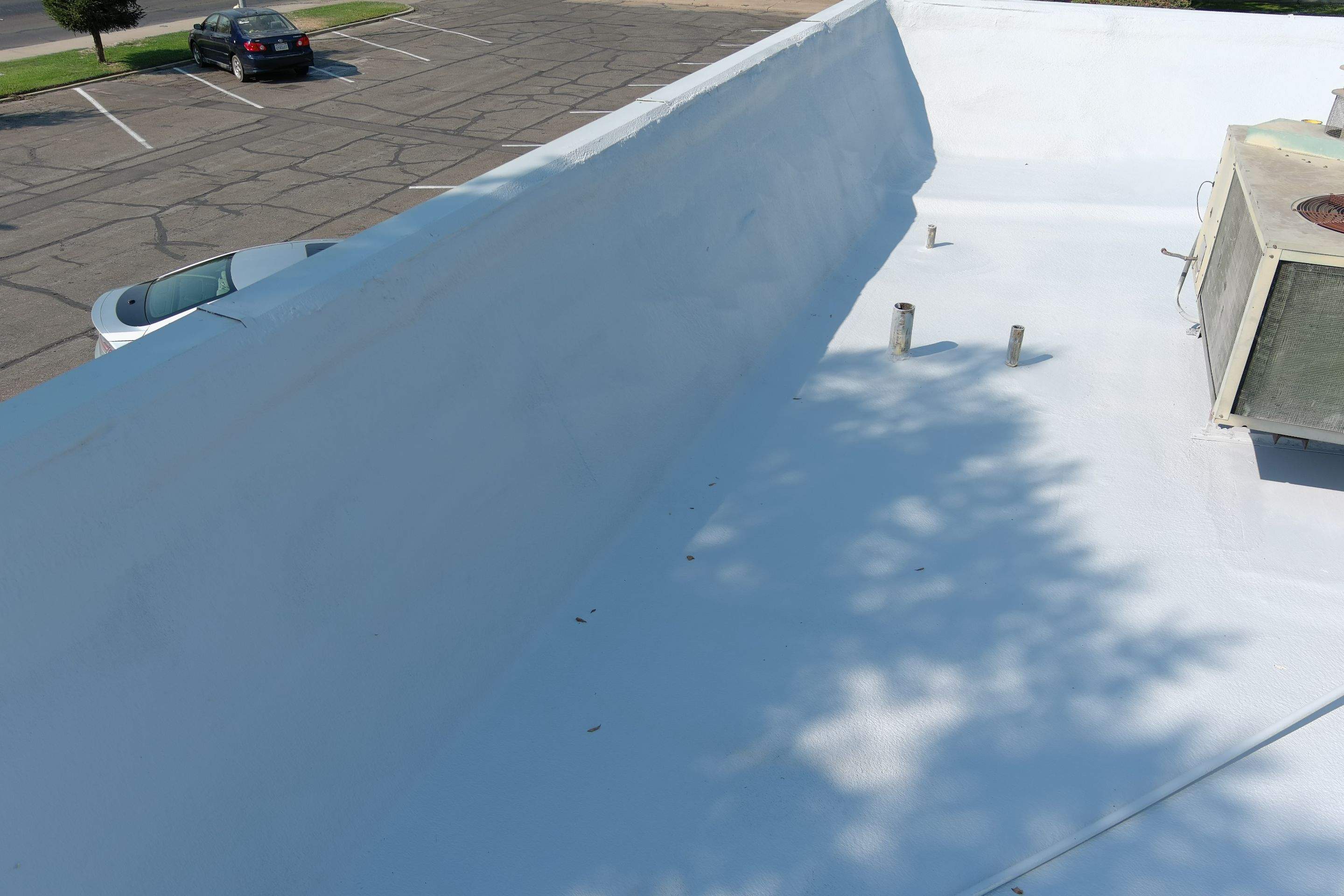 Commercial Roofing Installation using General Coatings acrylic coatings and spray foam by Straight Edge Roofing Inc