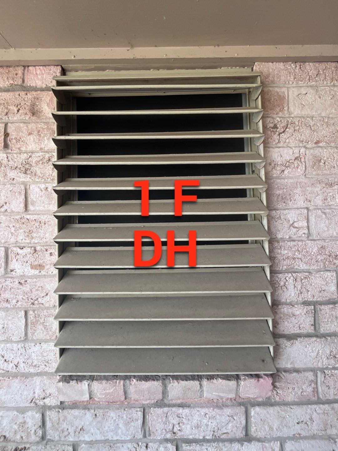 Colored Vinyl Windows to blend into brick by Bayfront Roofing and Construction