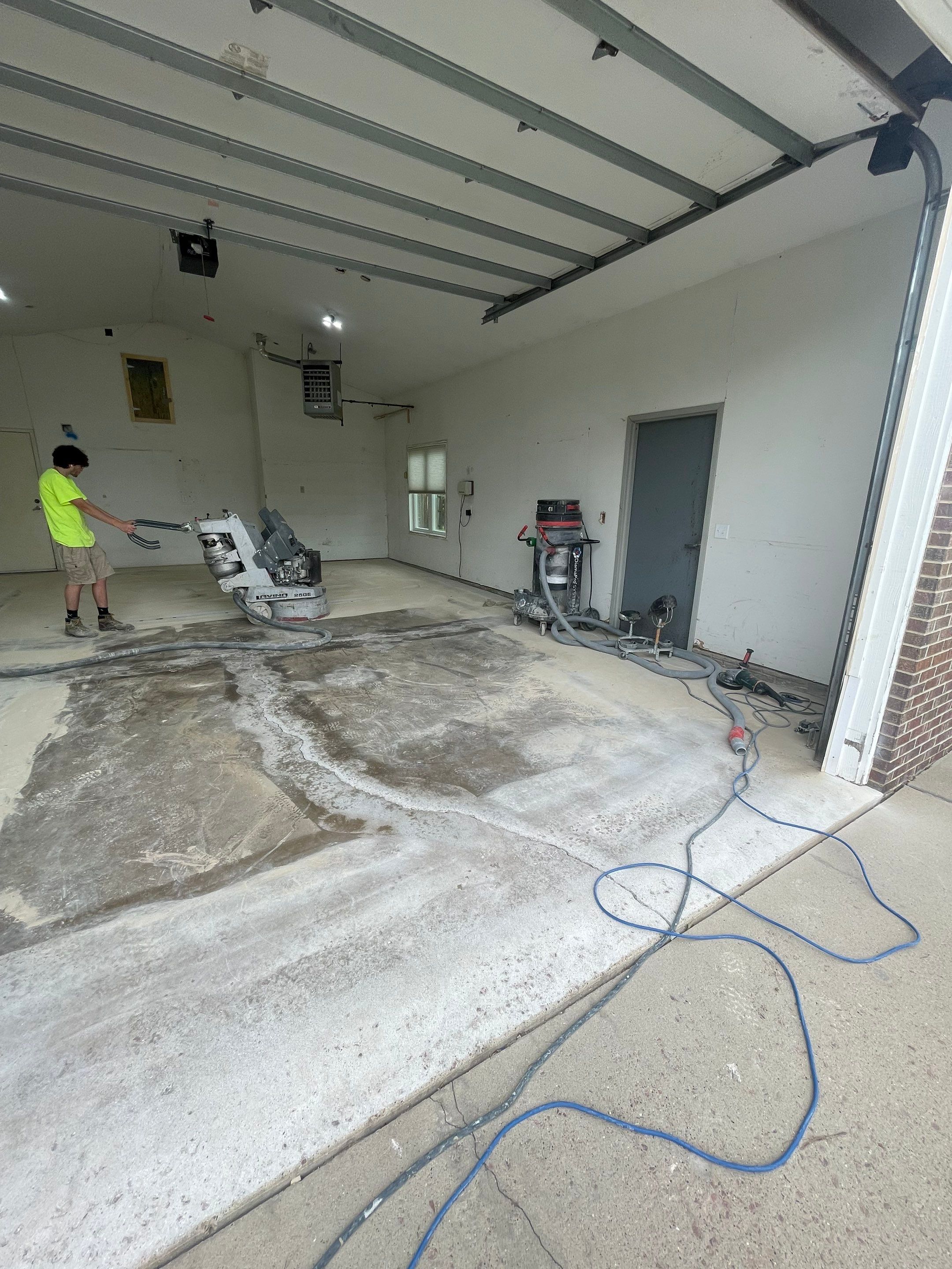 Coyote Flake Concrete Coating for Sioux Falls Garage by Select Painting, Coatings & Garage Cabinets