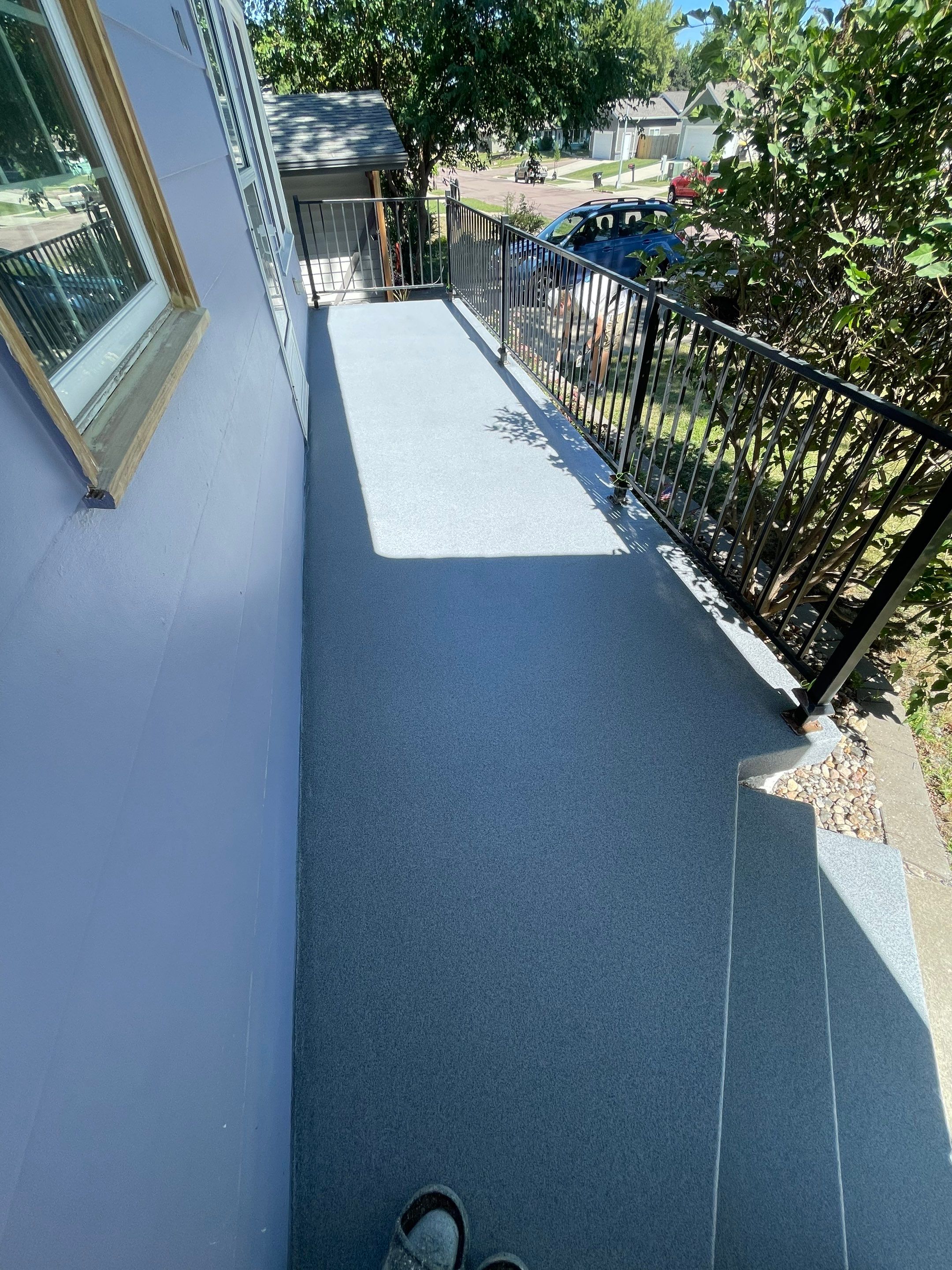 Sioux Falls Concrete Porch Coating with Starry Evening Finish by Select Painting, Coatings & Garage Cabinets