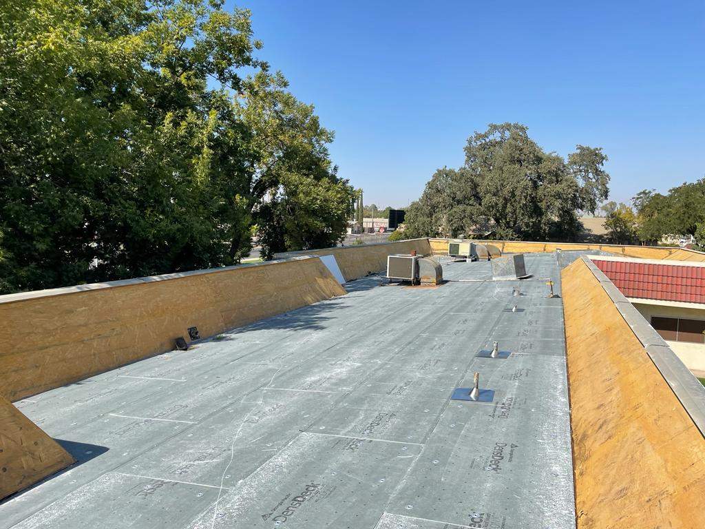 Commercial Roofing Installation using General Coatings acrylic coatings and spray foam by Straight Edge Roofing Inc