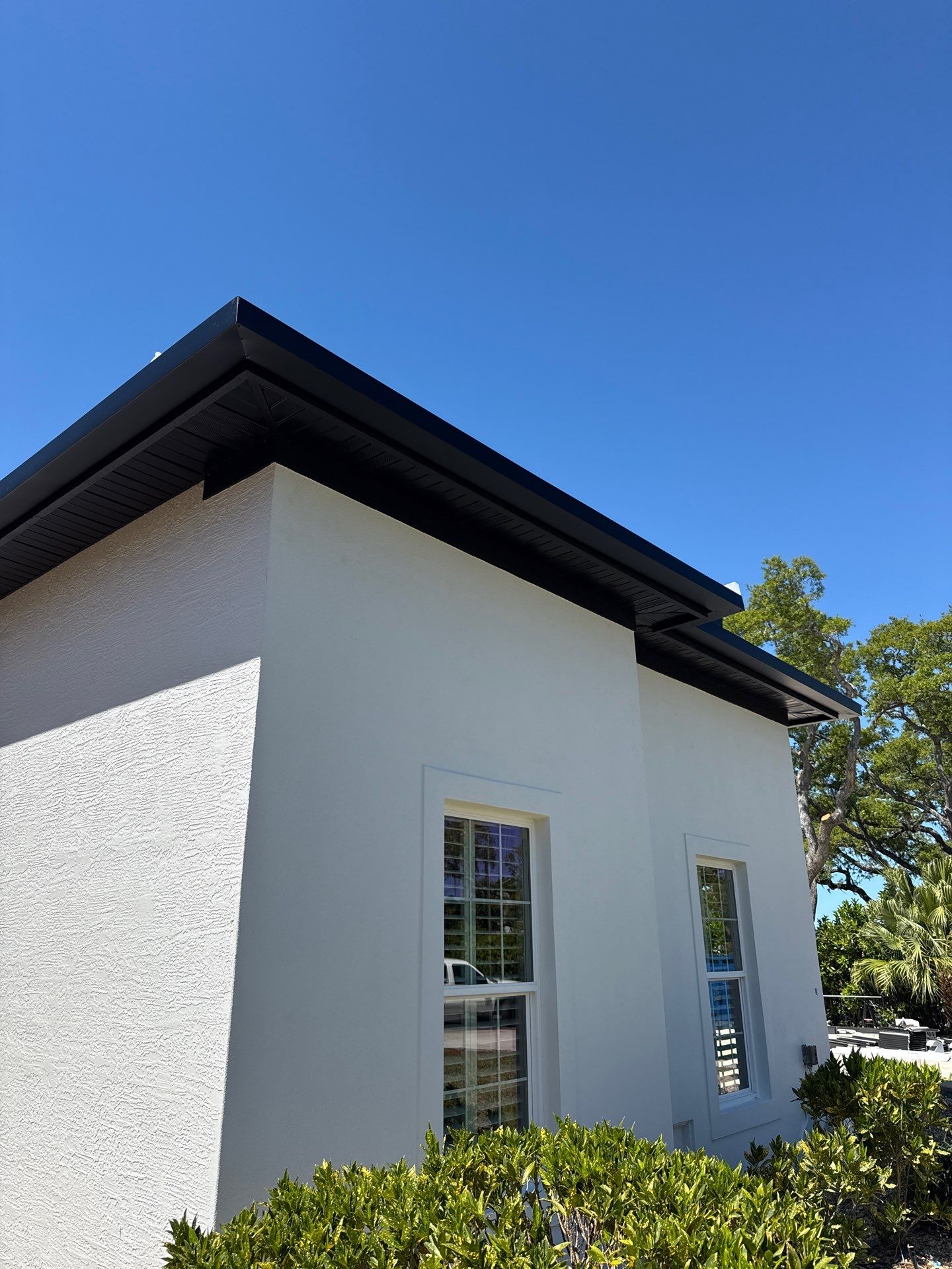 Soffit and Fascia Installation and black seamless gutters in Sarasota FL by Gutter Professors