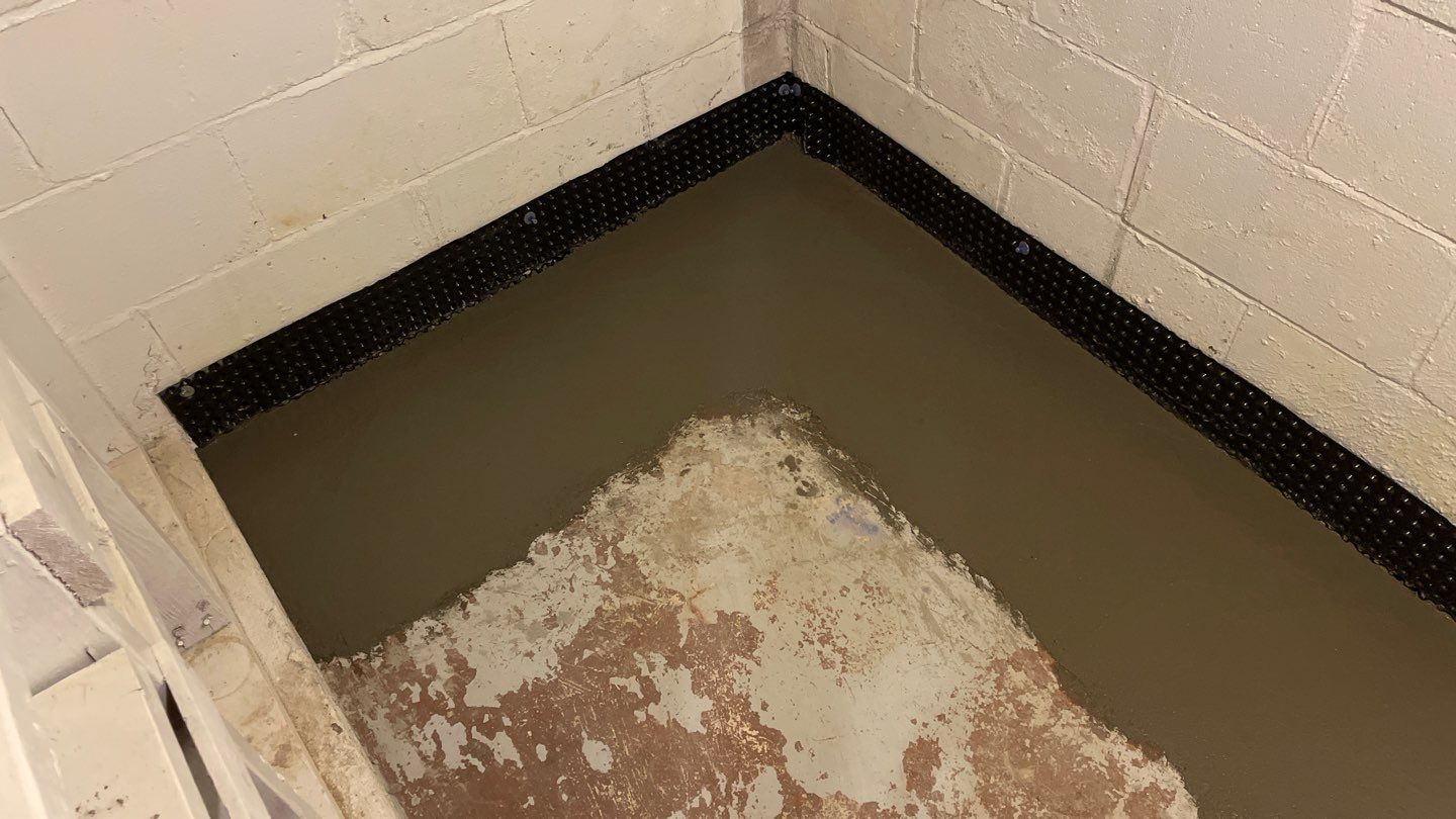 Basement Drain Tile & Sump Pump in Northeast Minneapolis by Waterproofing Northeast
