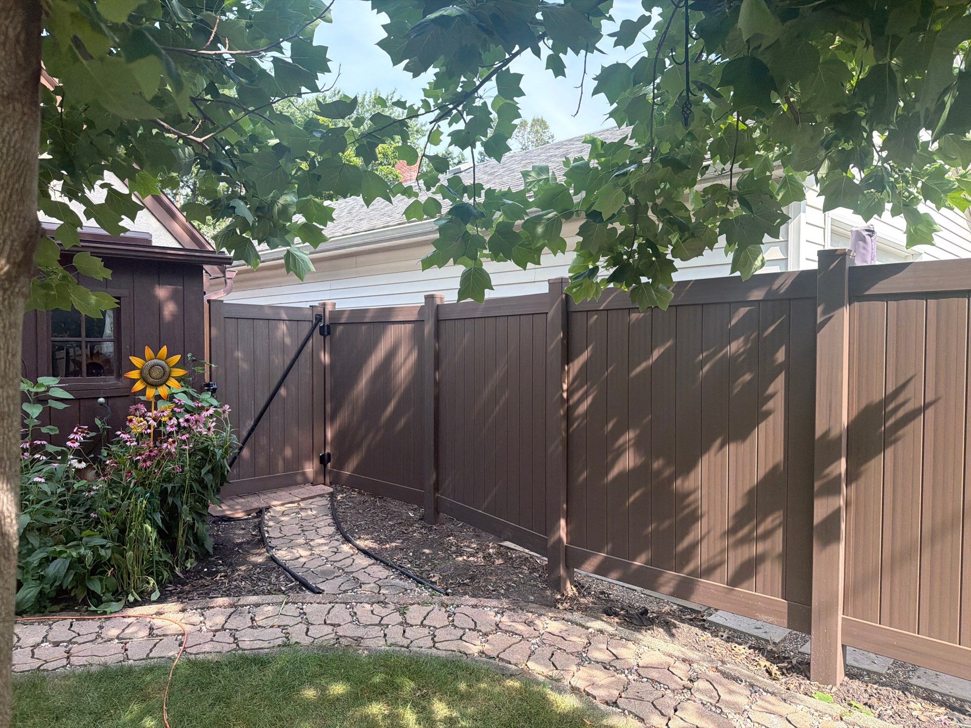 Walnut Vinyl Privacy Fence Installation in Waterloo by Perfect Picket Fence and Stain