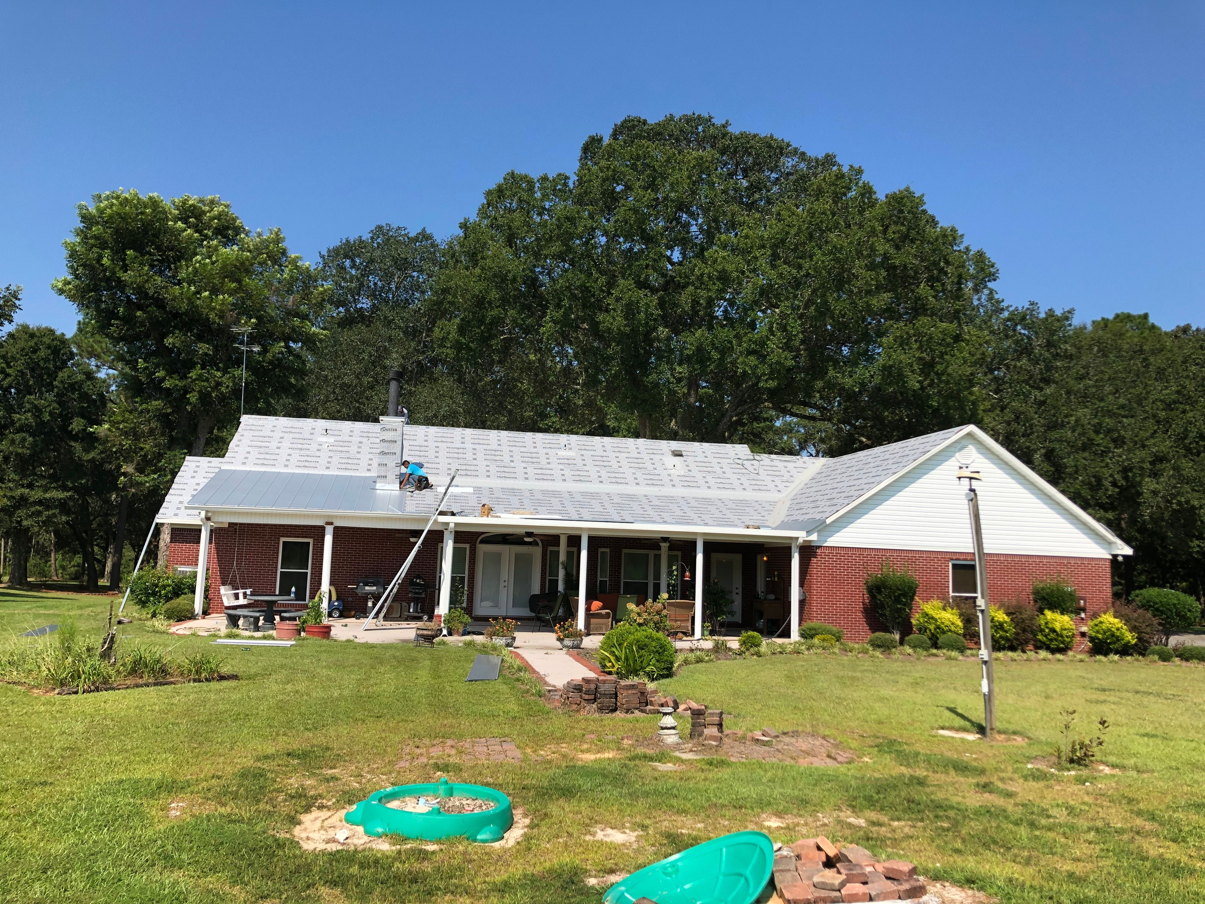 Residential Roofing Installation using Metal roofing by American Roofing & Construction LLC