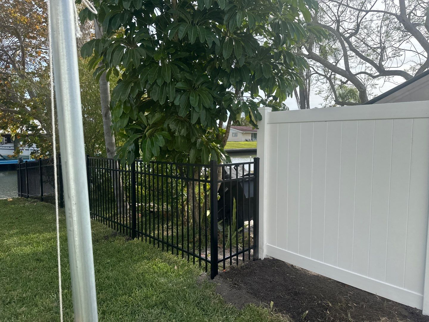 Aluminum Fence Installation using Black 3 Rail Aluminum and Vinyl Privacy Fence  by Asap fence and gates, LLC