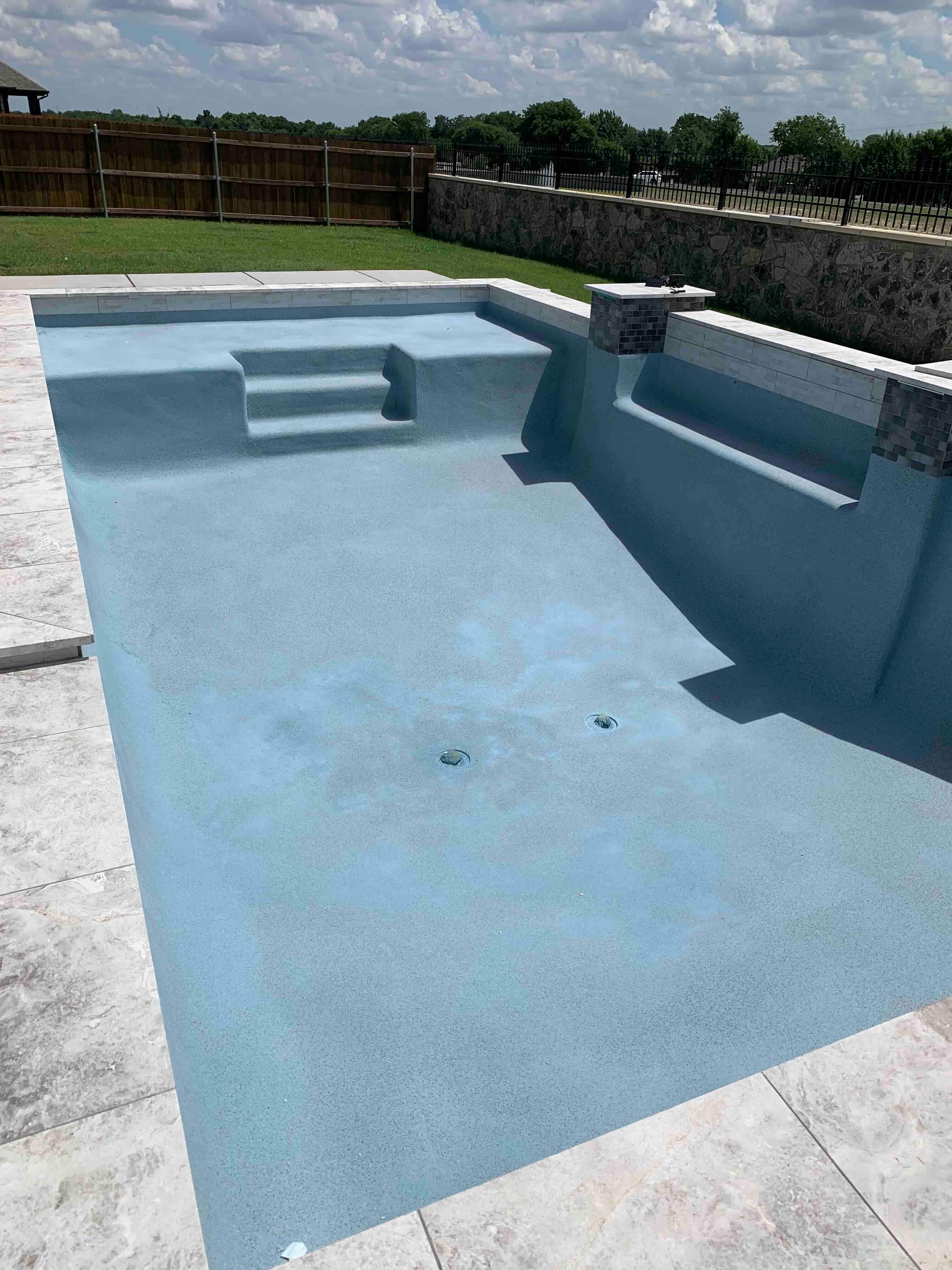 Geometric Pool with Tanning Ledge and Turf Accents by Pinnacle Pools and Spas - DFW