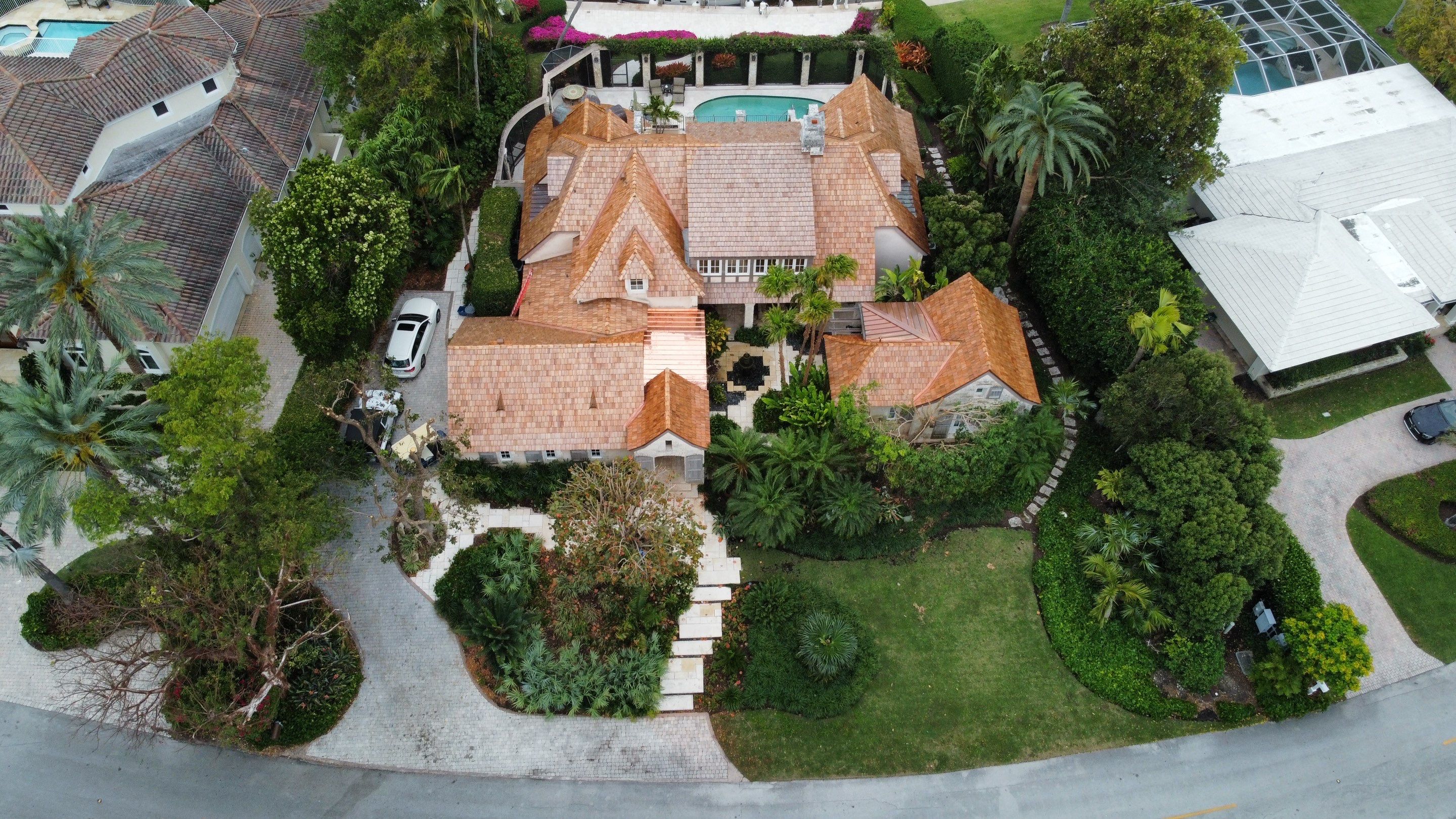 Residential Roofing Installation using Cedar Wood Shakes on the Main Roof and 16 oz Copper on Dormer by BOB HILSON & CO INC