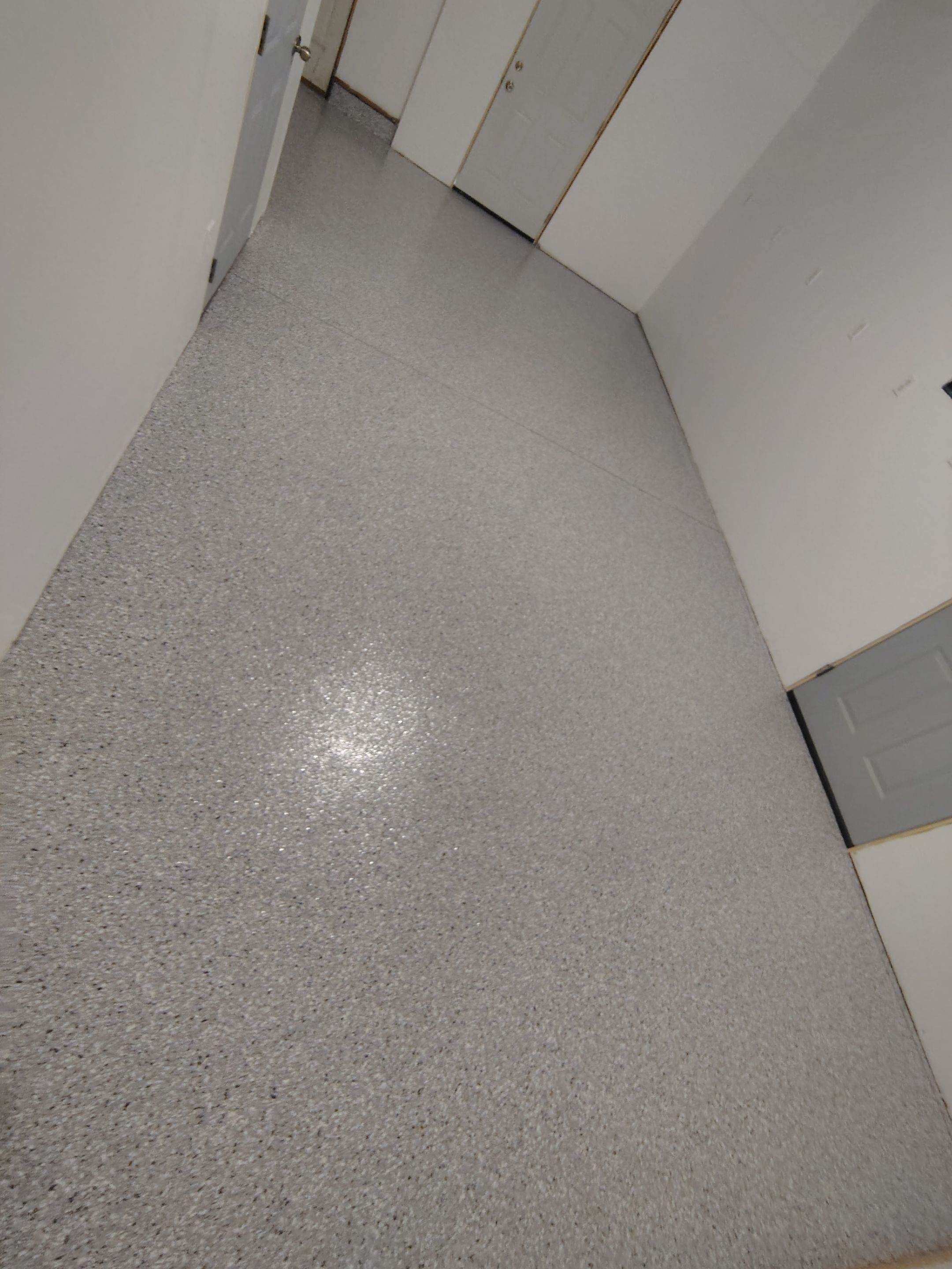 Decorative Chip Concrete Coating Installation in Luverne by Select Painting, Coatings & Garage Cabinets