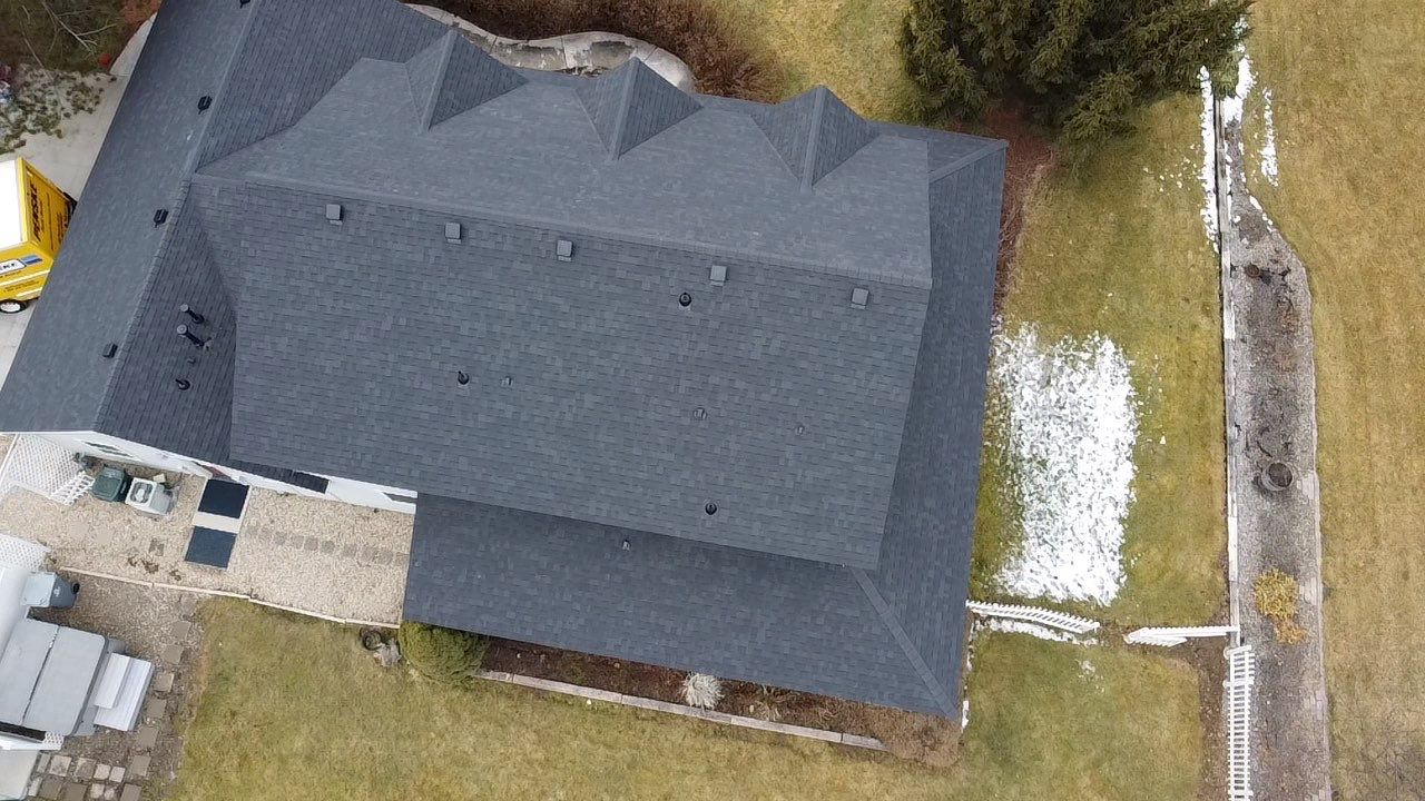 Big Style in Mission Pointe – New Roof with DecoRidge & Onyx Black Finish by ID Roofing LLC