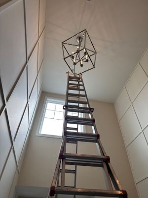 ZAM Installs Statement Light in Tall Entryway