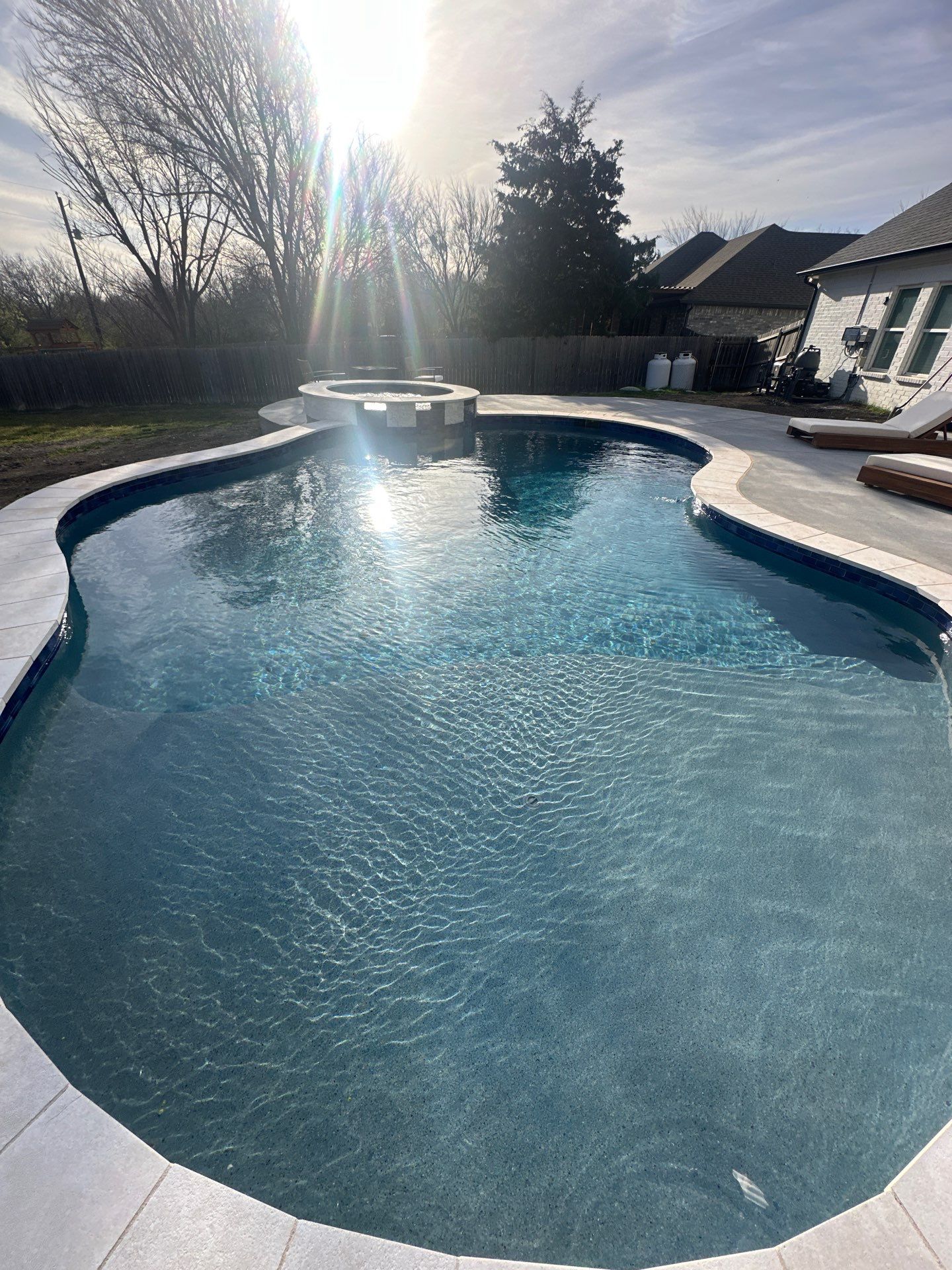 Freeform Pool with Raised Spa and Water Feature by Pinnacle Pools and Spas - DFW