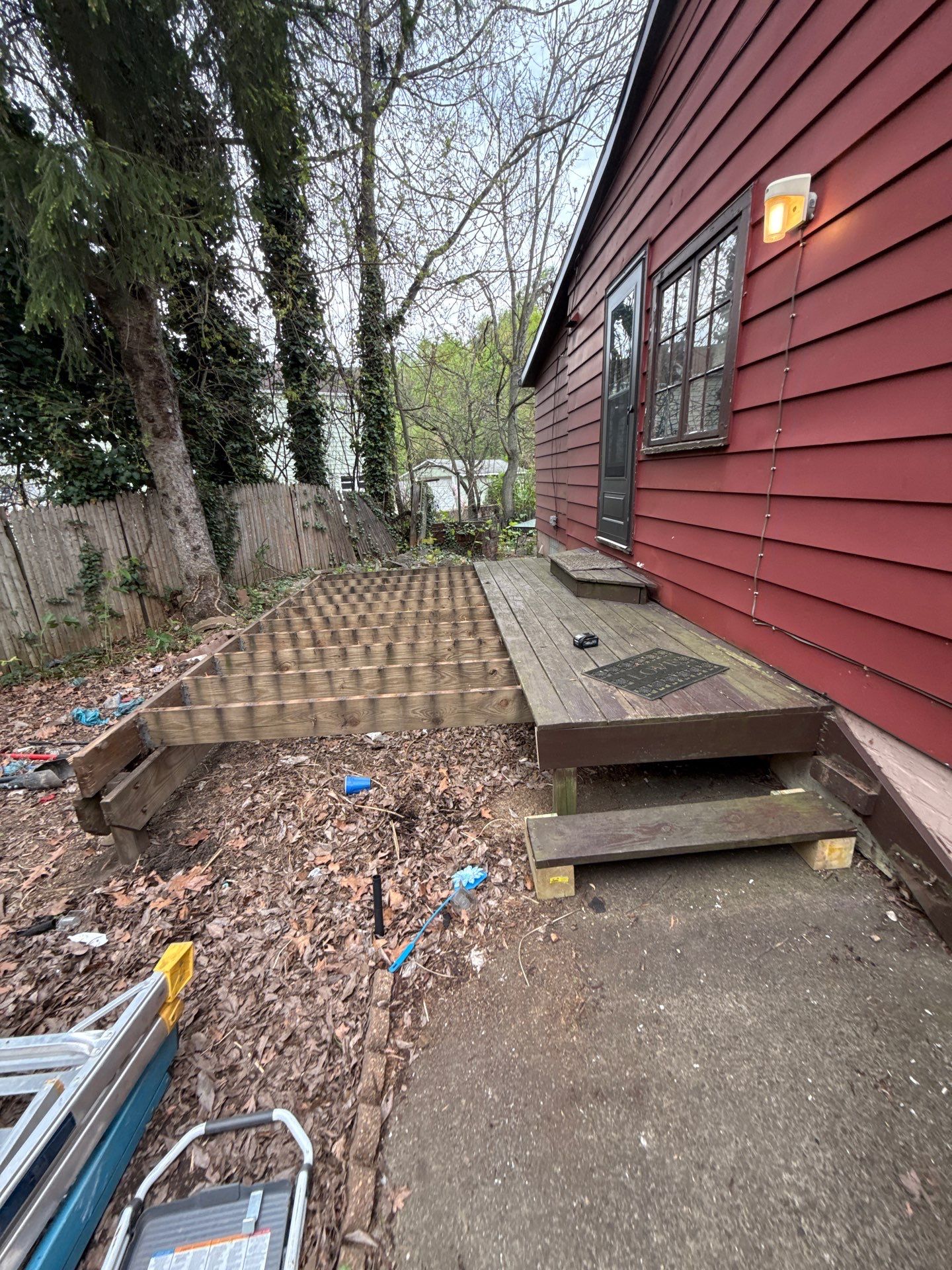 Roof sunspace deck  by Cousins Roofing Siding & Decks