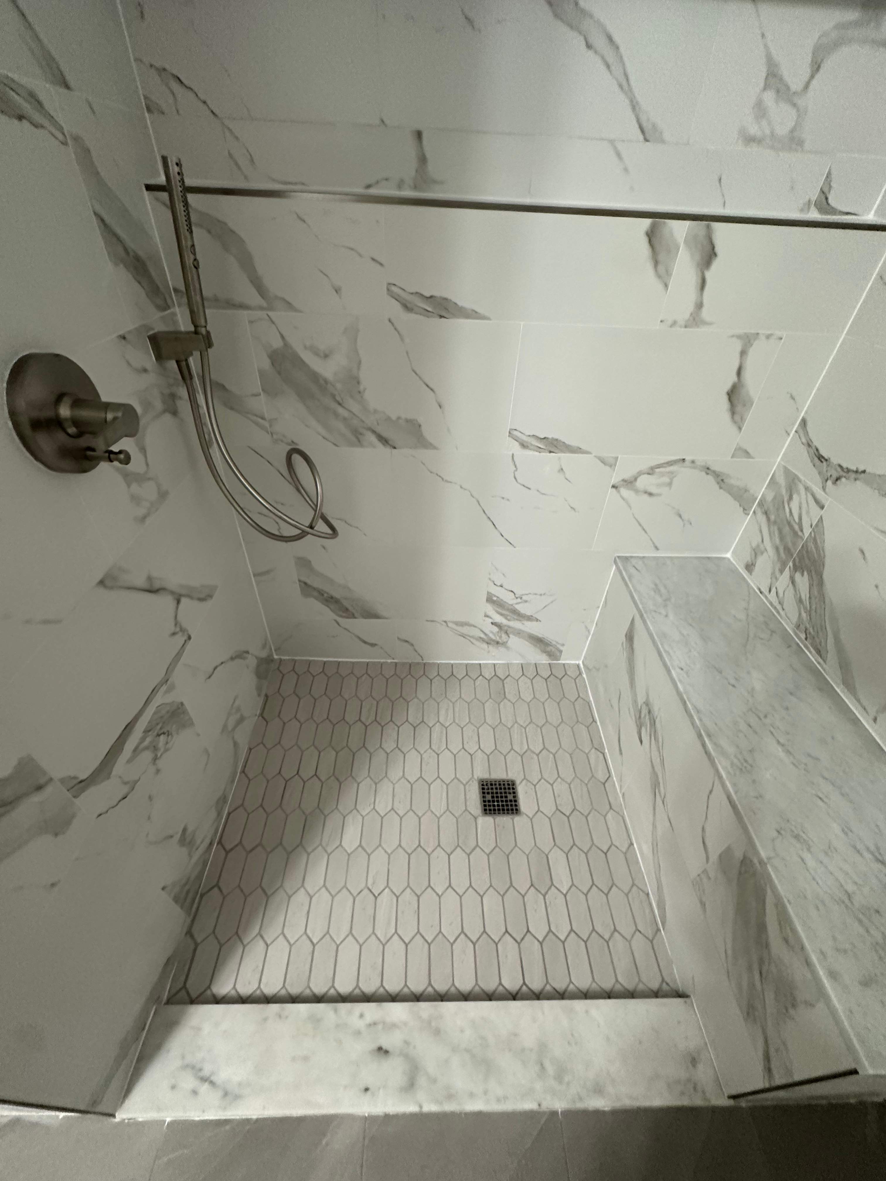 Tub to walk-in shower conversion, and tile flooring by Prudencio