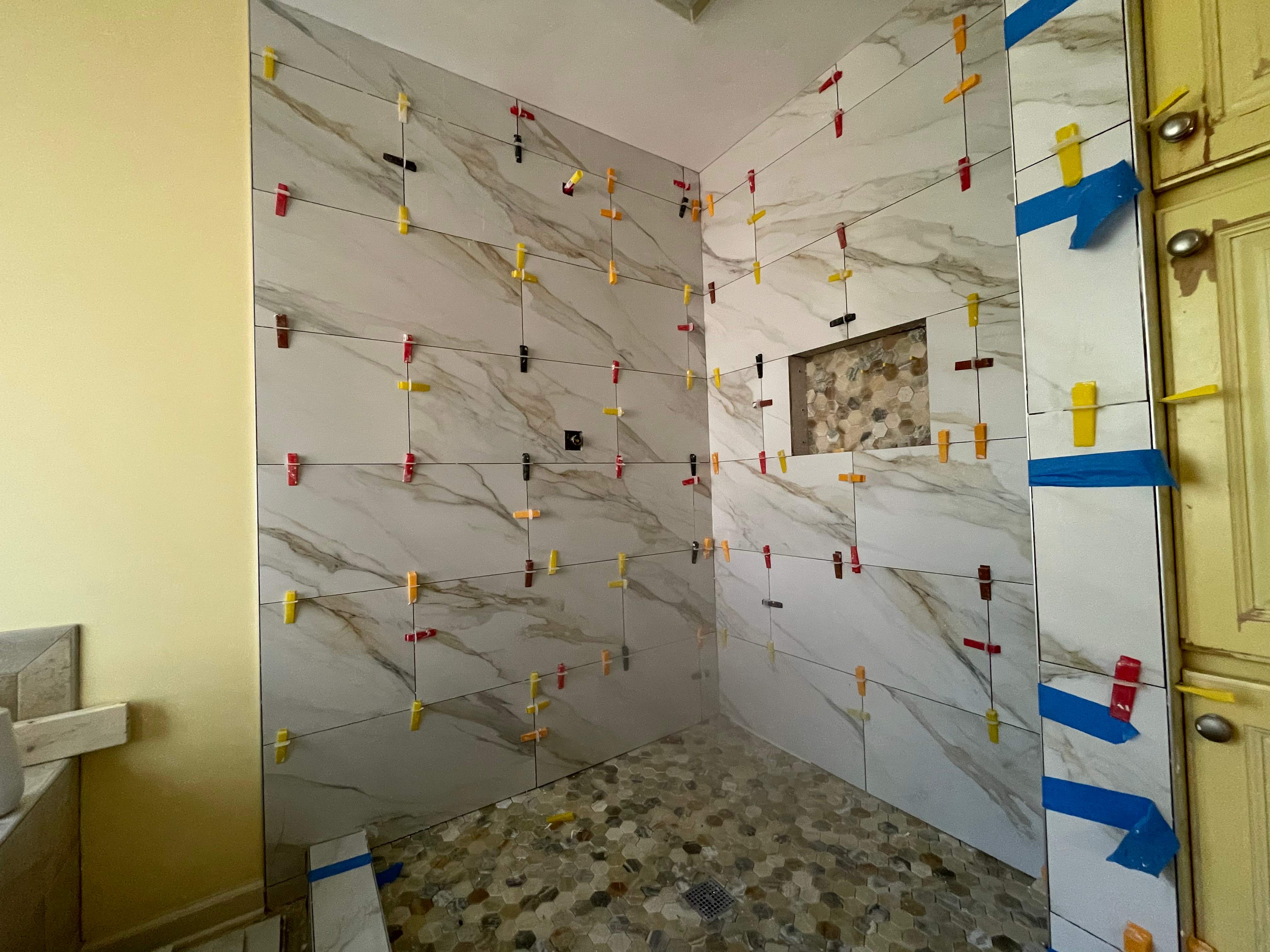 Master bathroom shower renovation, and tile flooring by Prudencio