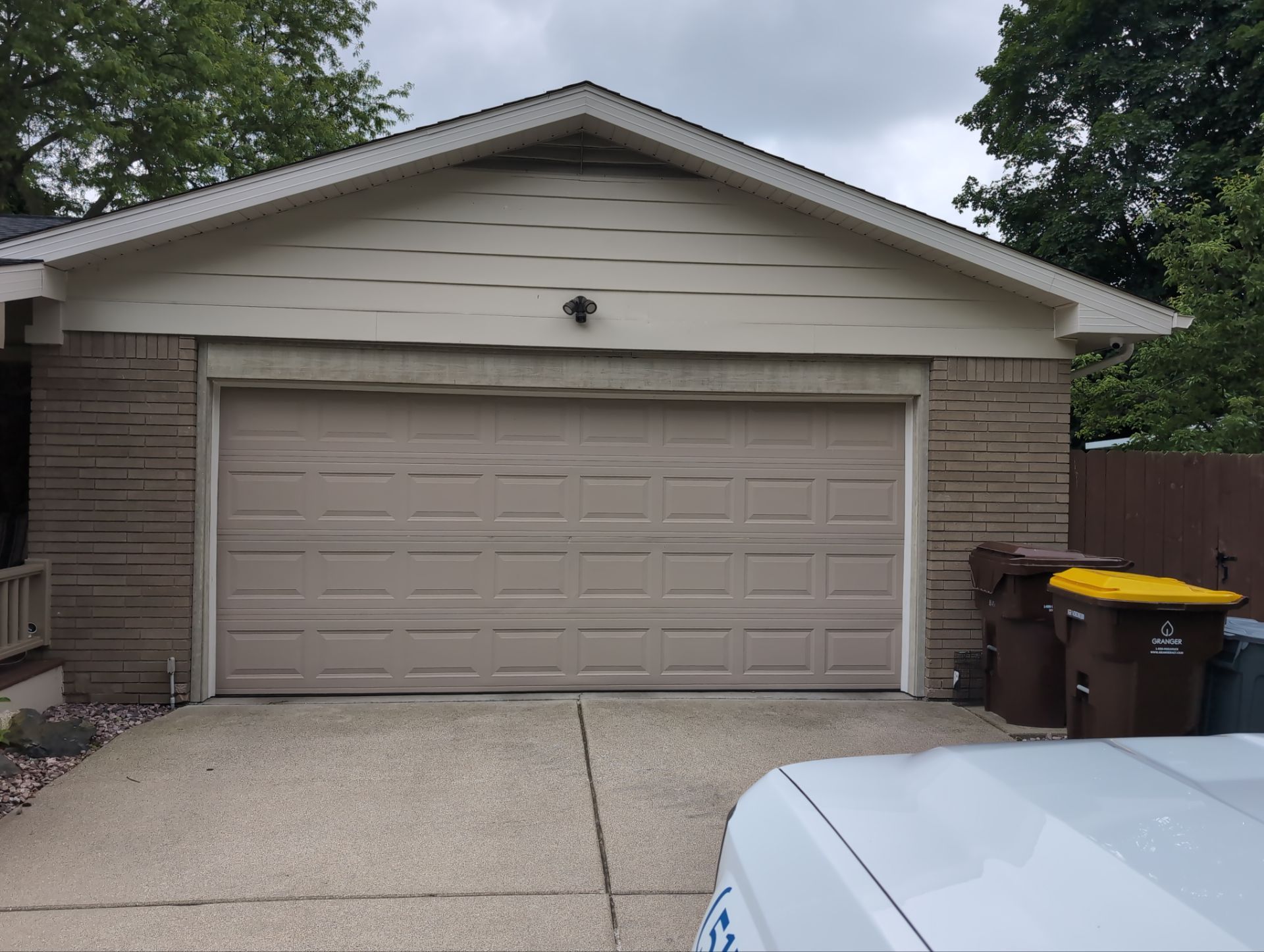 Installing new Roof, Fascia, Soffit, and Gutters. New custom trim around garage door. by Acme Exteriors