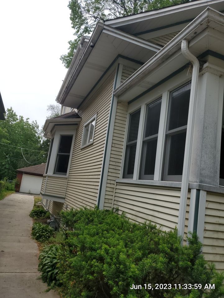 Housewashing  using Algaecide, soft wash soap by Northern Power Washing LLC.