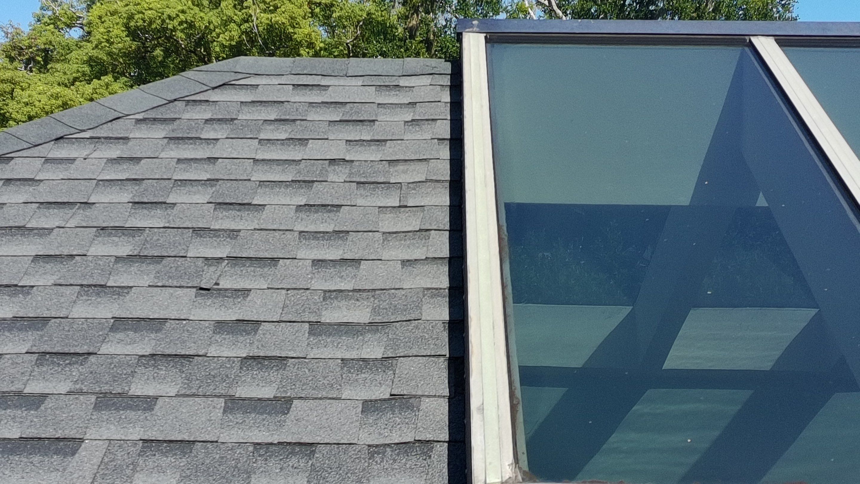 Ridge Skylight Repair and Shingle Roof Maintenance in Winter Park by Fortified Roofing Solutions Corp.