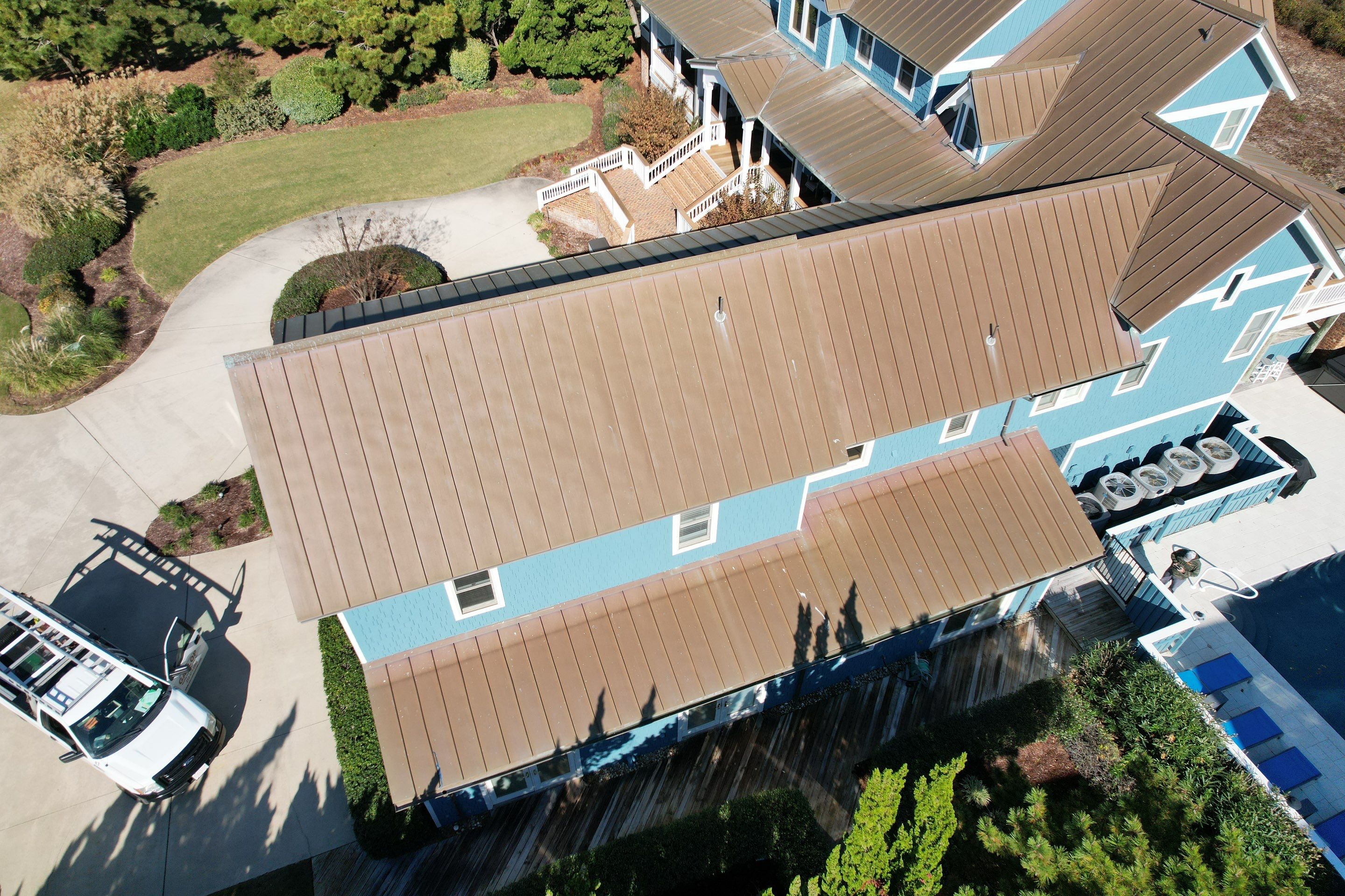 Large Metal Roof Transformation by Gallop Roofing & Remodeling, Inc.