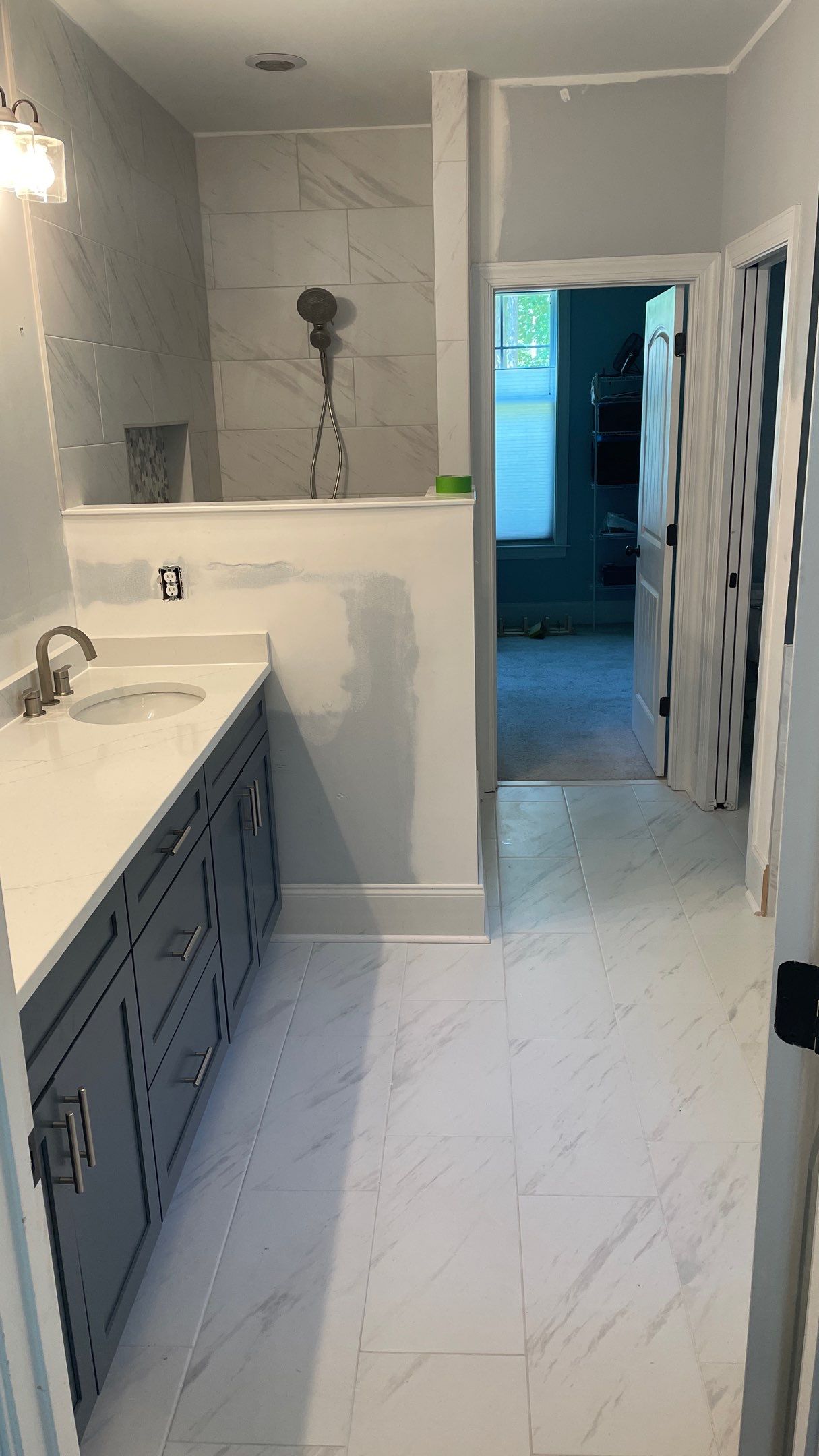 Bright Bathroom Remodel with Wall Removal, Stand Alone Tub and New Vanity by Footprints Floors of Coastal Carolina
