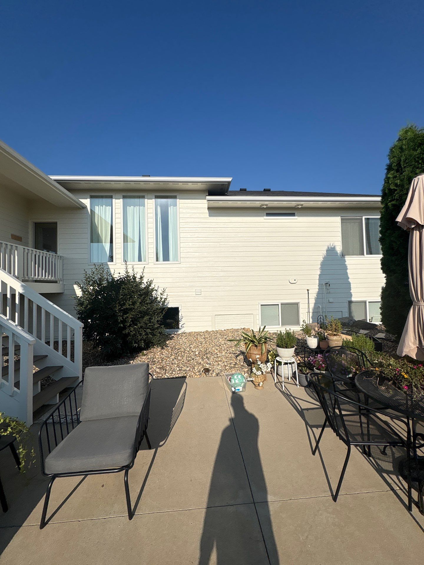 Sioux Falls Exterior Residential Siding and Deck Painting Project by Select Painting, Coatings & Garage Cabinets