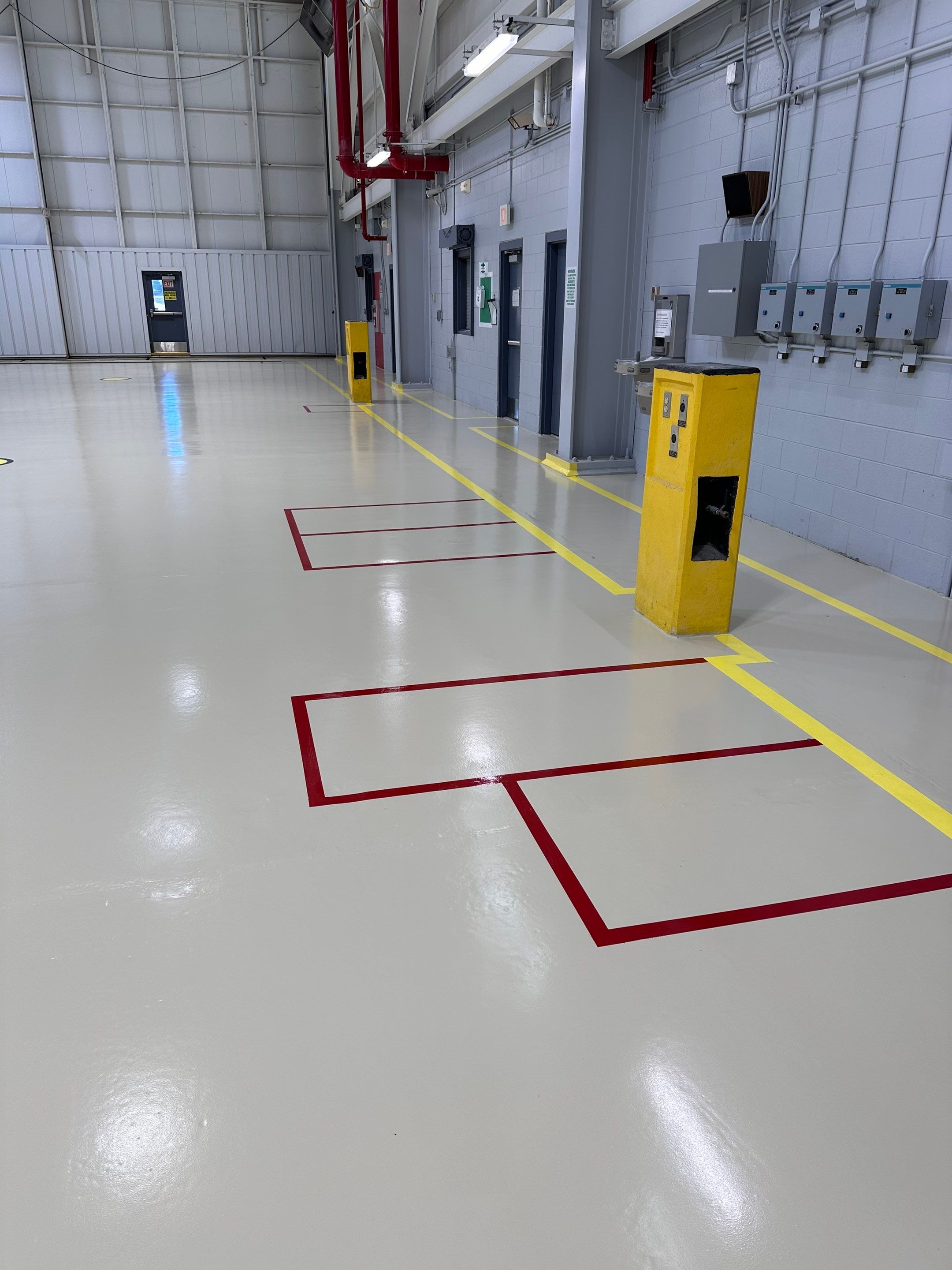 Industrial Epoxy Flooring for Army National Guard Hangar in Mobile by Cornerstone Hard Surface Restoration 