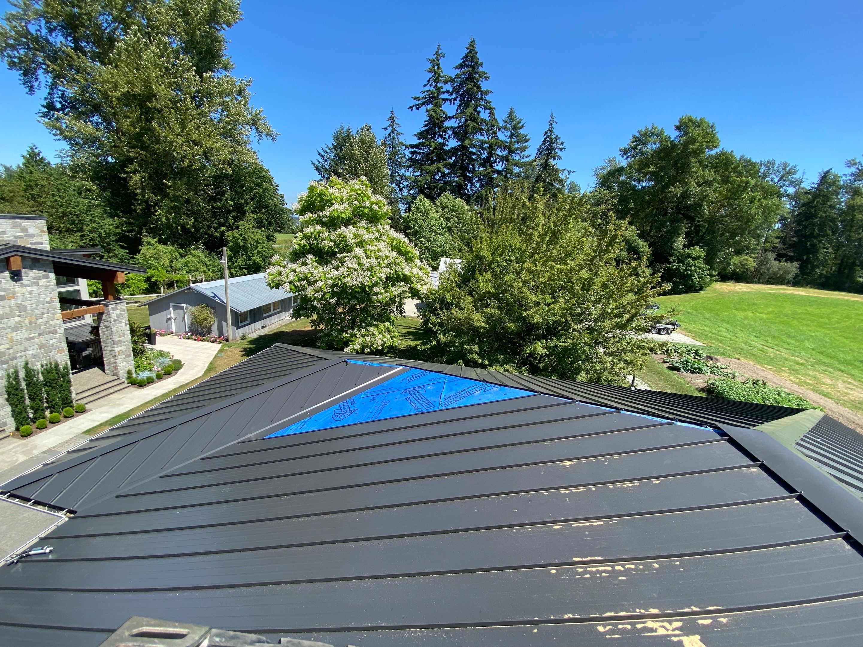 Residential Roofing Installation using 12" Prolok metal  by Top Notch Roofing Inc