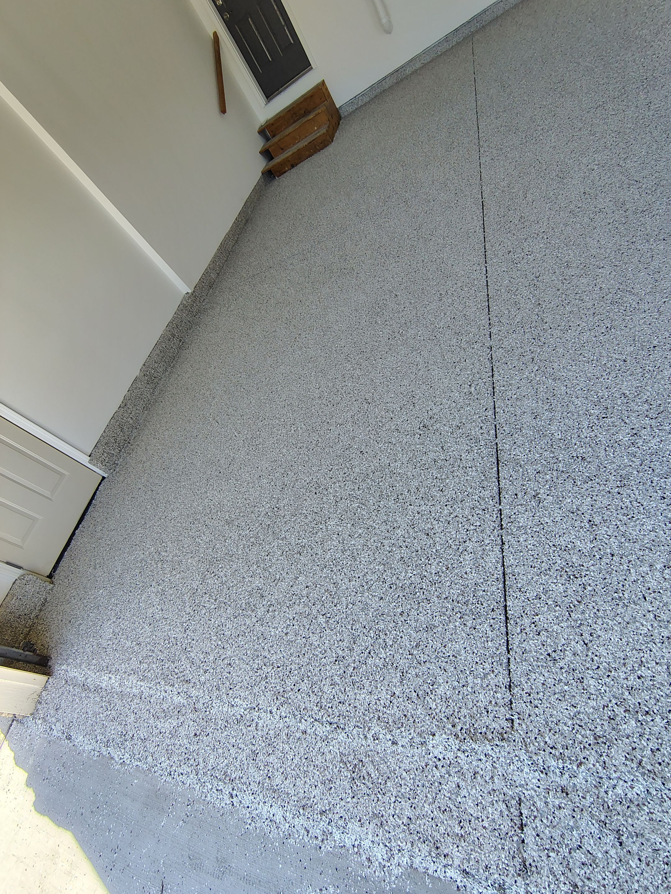Custom Grey Speckled Epoxy Floor Coating for Sioux Falls Garage by Select Painting, Coatings & Garage Cabinets