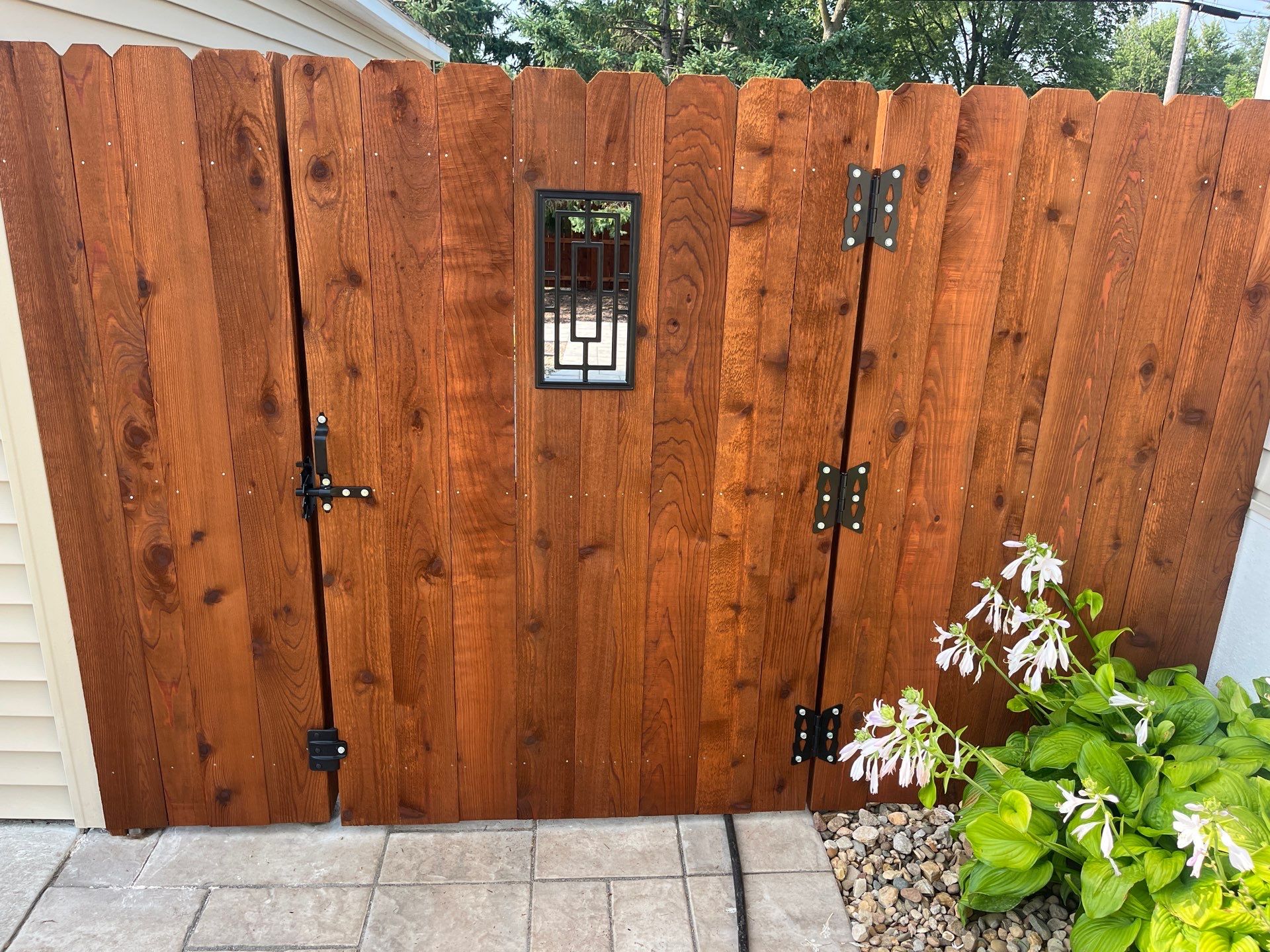 Custom Chestnut Stained Cedar Privacy Fence in Waterloo by Perfect Picket Fence and Stain