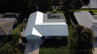 Residential Roofing Installation using 1" Nail strip metal roof
