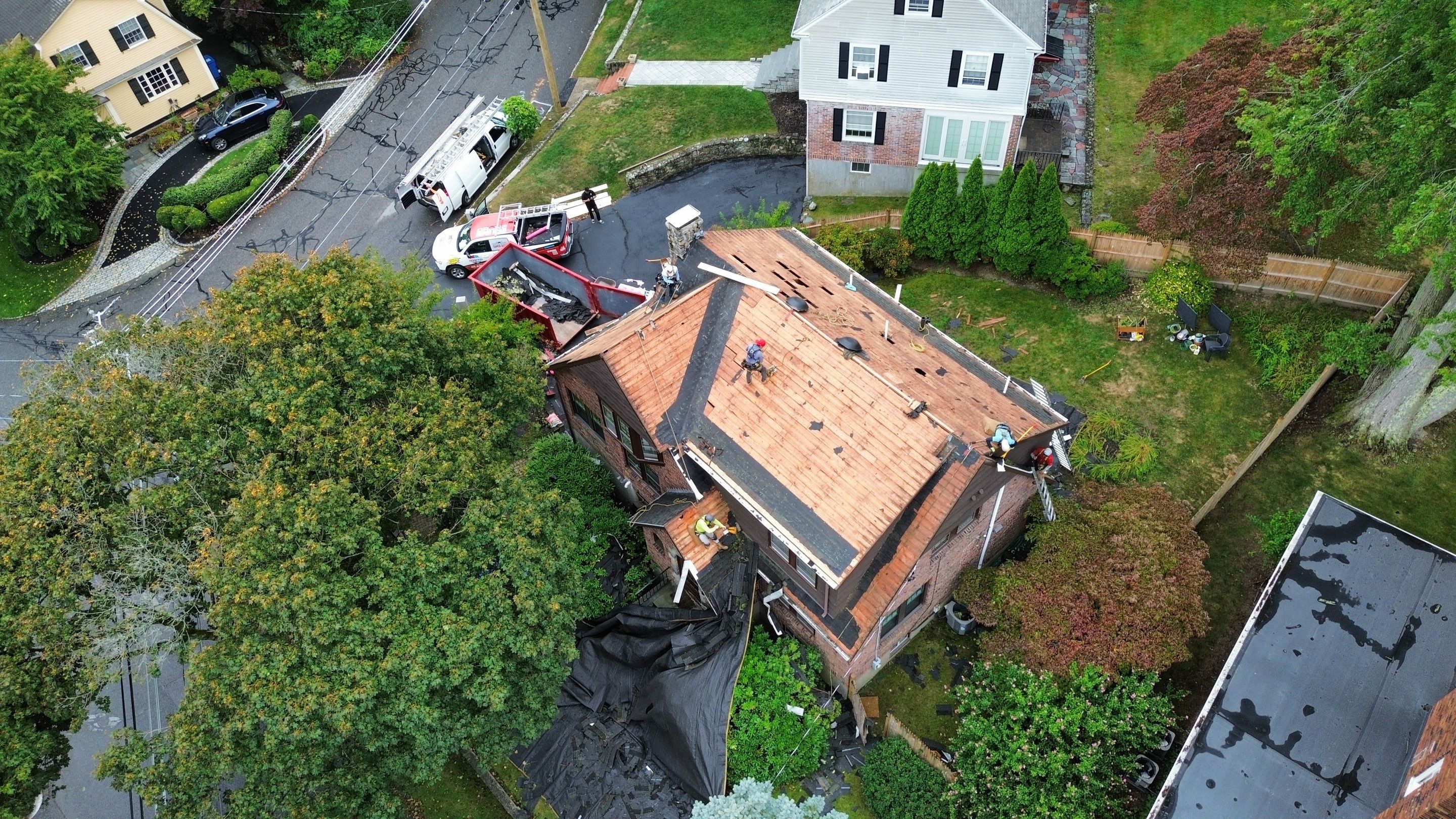 Roof Replacement with Skylight & Downspout Work in Belmont, MA by Mighty Dog Roofing of Greater Middlesex County