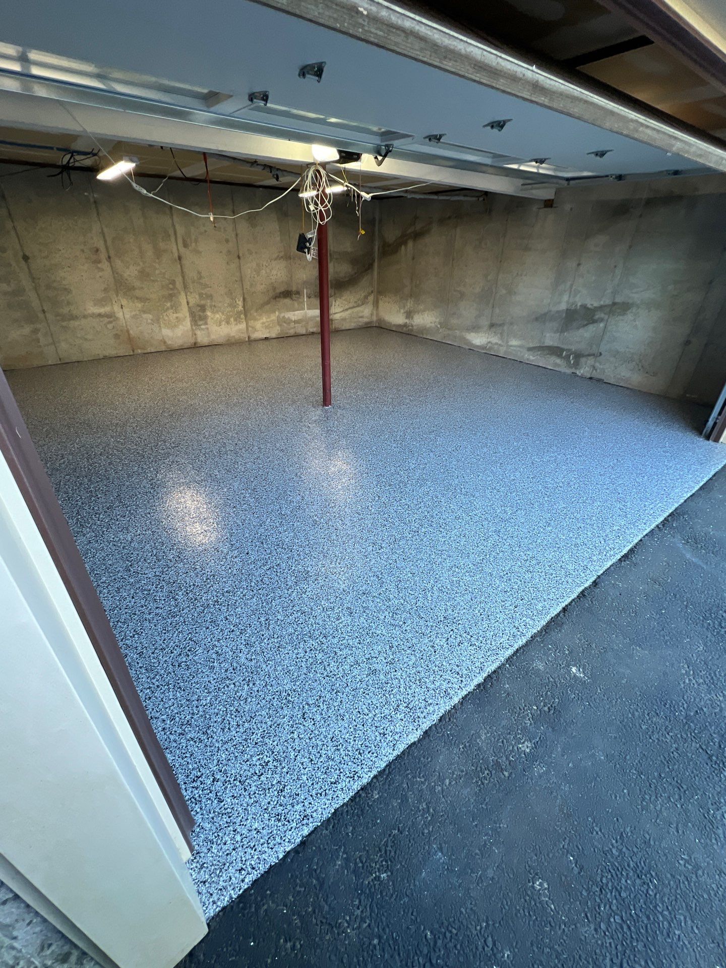 Garage in Londonderry, NH 03053 by Symphony Concrete Coatings