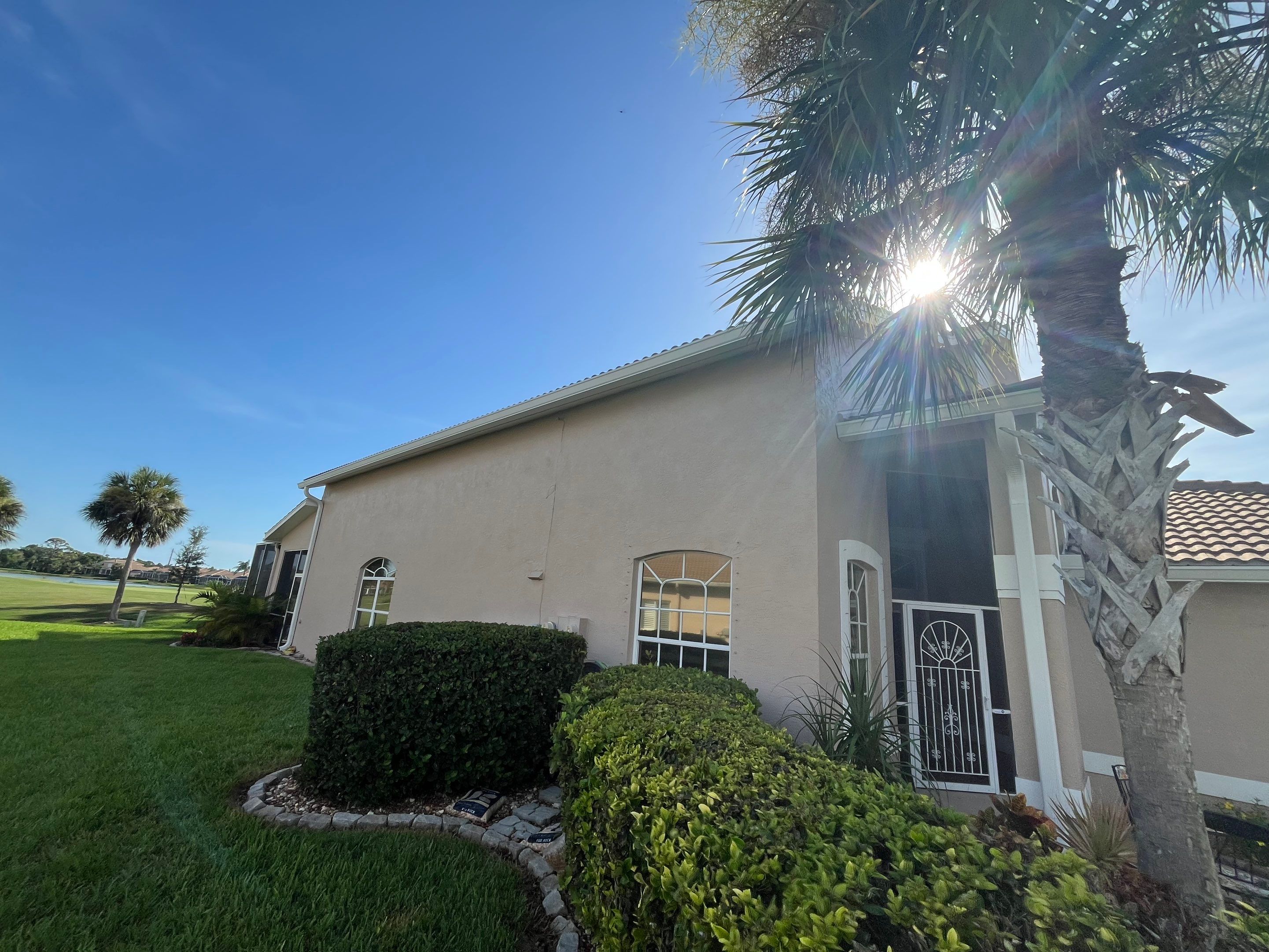 Replace White Seamless Gutters Installation in Sarasota FL by Gutter Professors