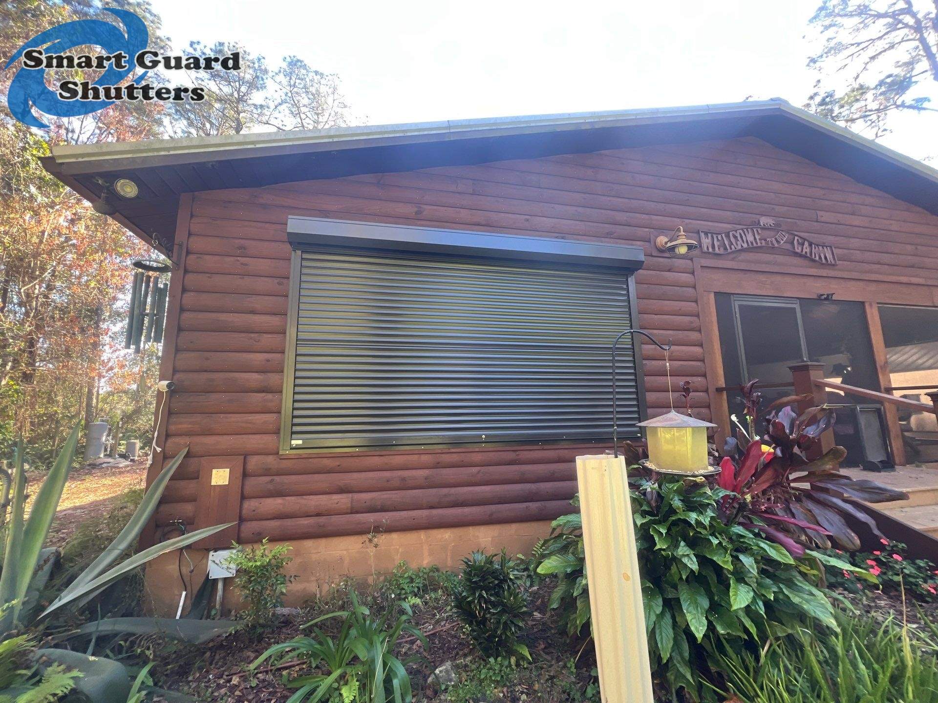 Hurricane Protection in Bronze/Grey Brown by Smart Guard Shutters