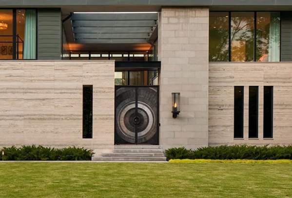 Custom Metal Entry Door and Exterior Lighting Installation by Solara Custom Living