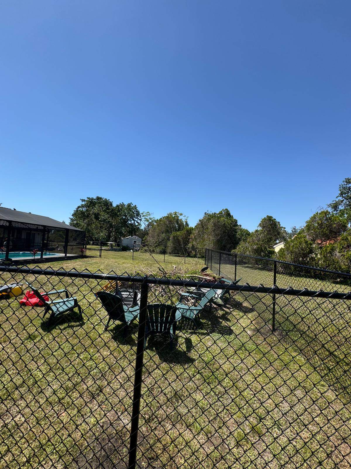 Black Chain Link Residential Backyard Fence Installation in North Port by True Fence LLC