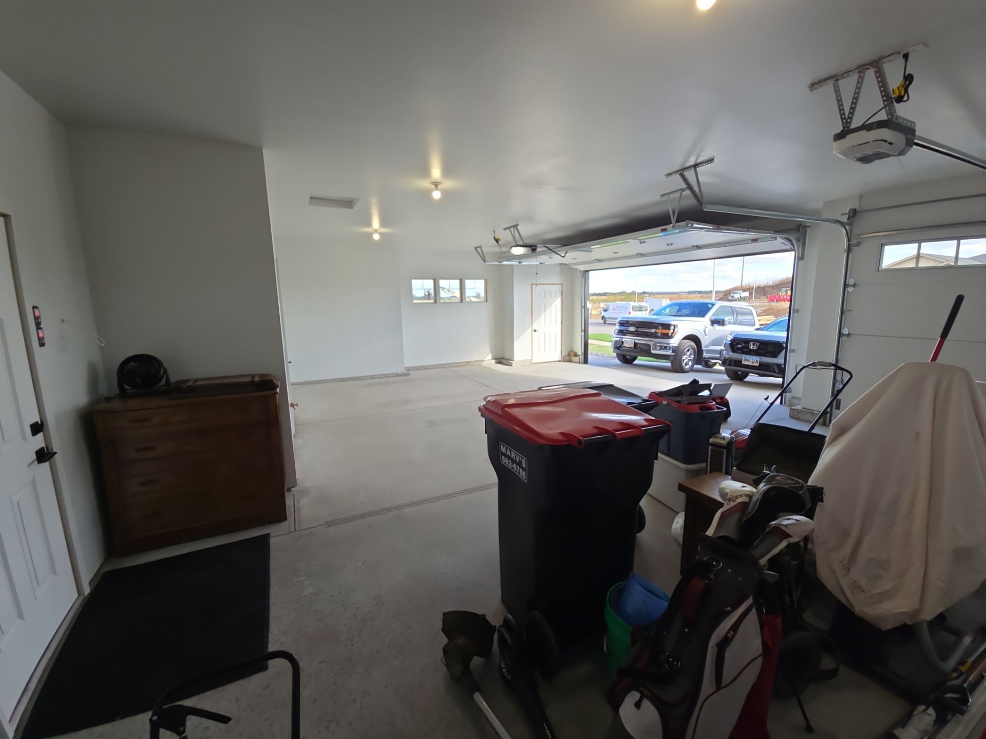 High-Gloss Epoxy Flake Garage Floor Coating in Brandon by Select Painting, Coatings & Garage Cabinets