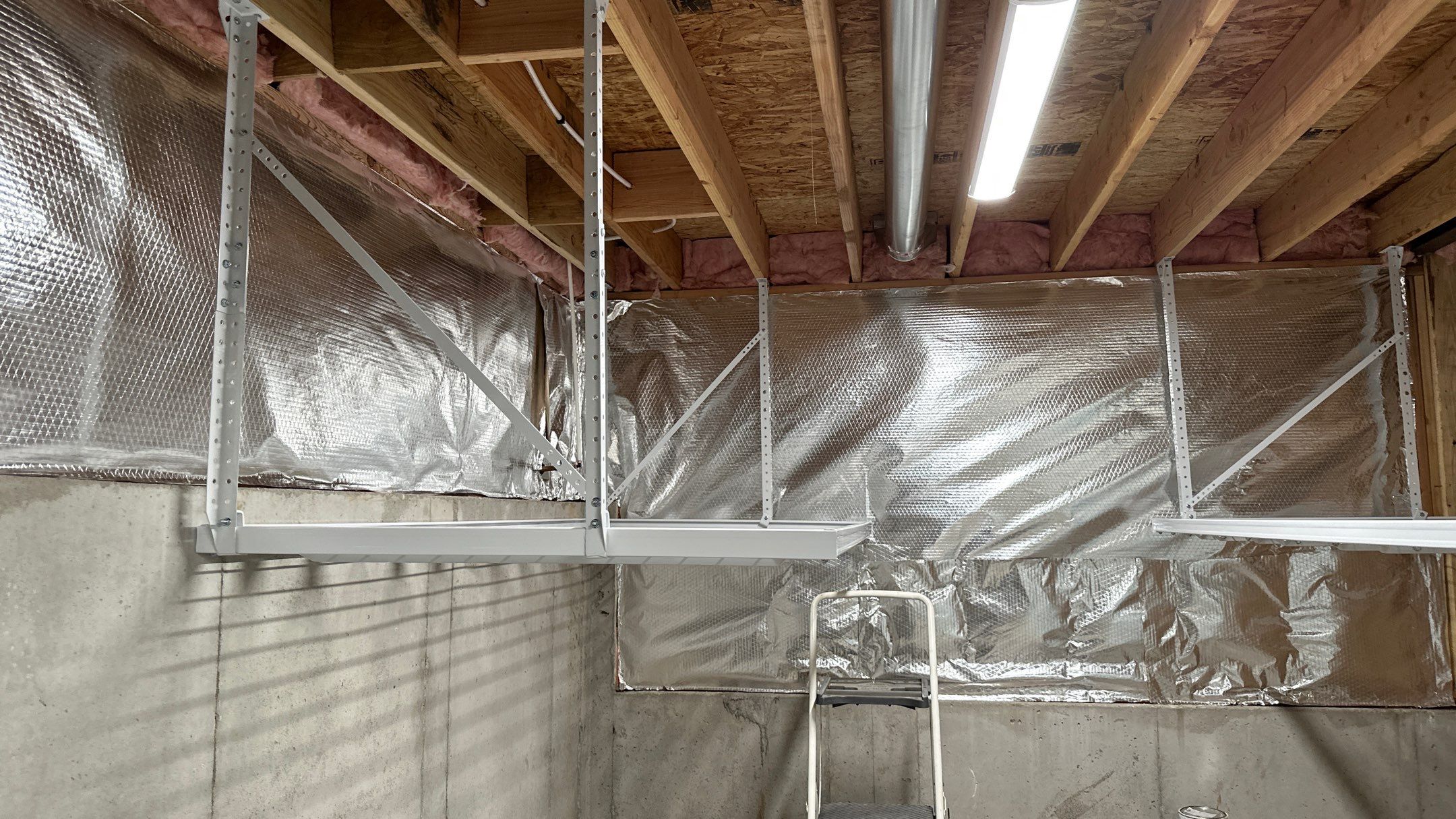 Brandon C. added these overhead racks to upgrade his storage  by Banner Garage