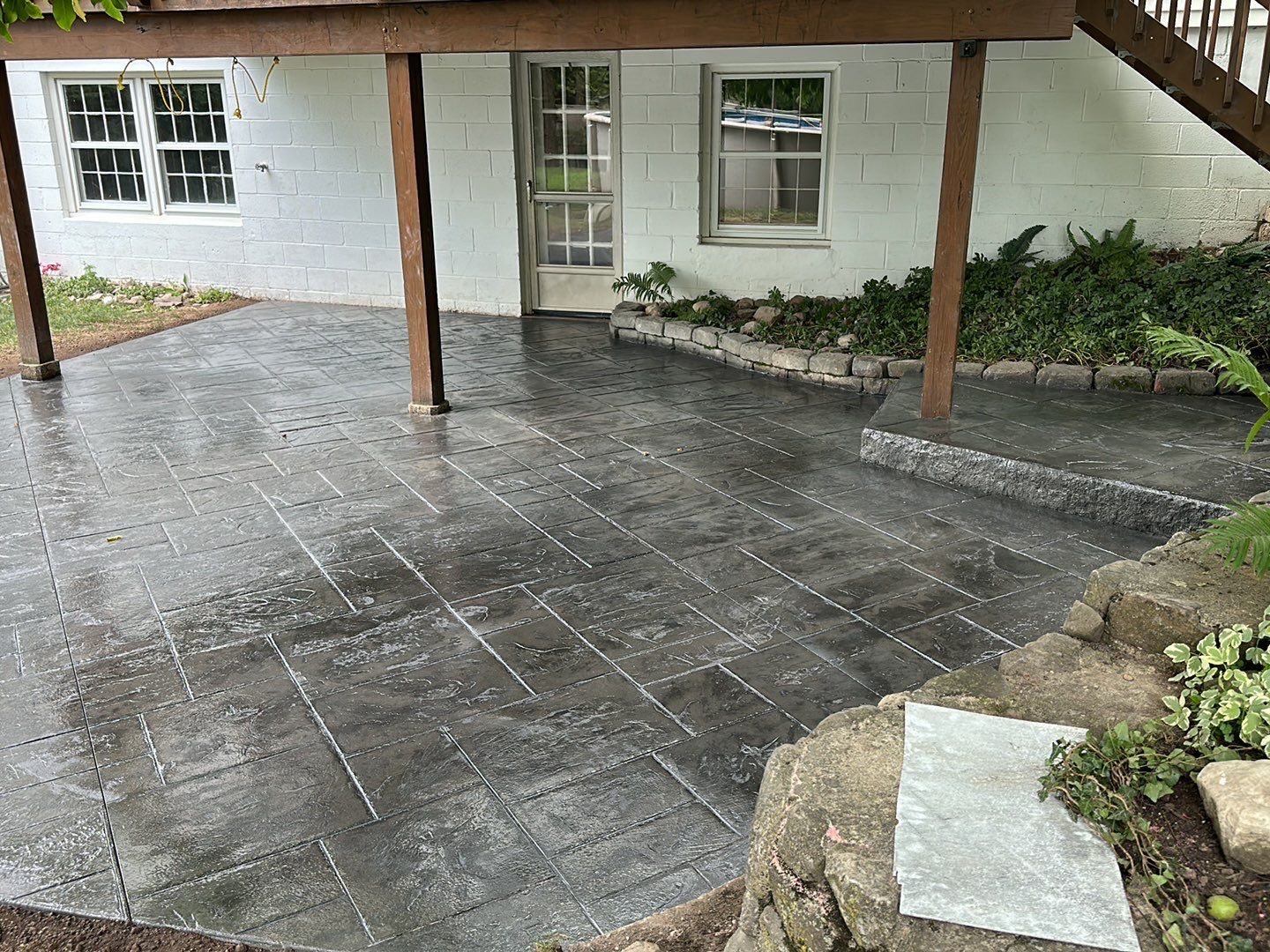 Majestic ashlar stamped concrete patio  by NG Masonry & Construction LLC