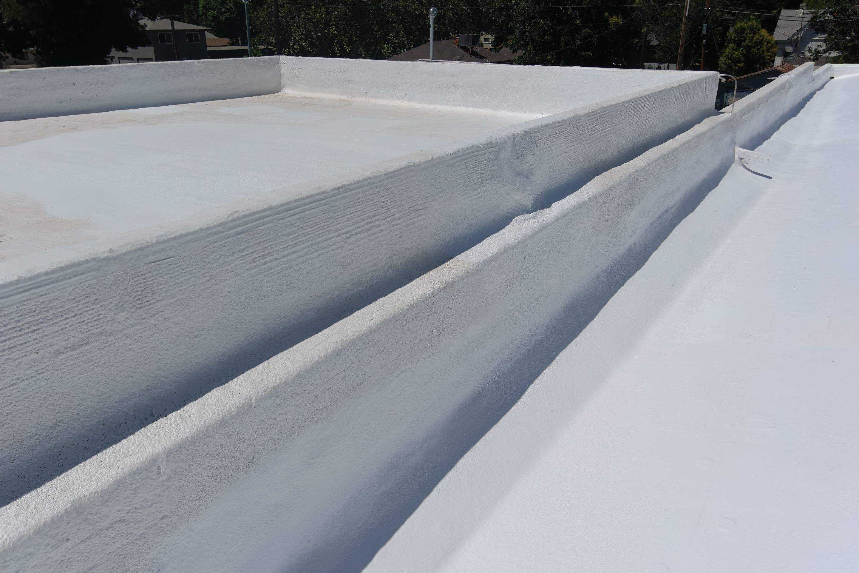 Commercial Roofing Installation using Conklin BenchPly system with PUMA top coat (imbedded fabric system) by Straight Edge Roofing Inc