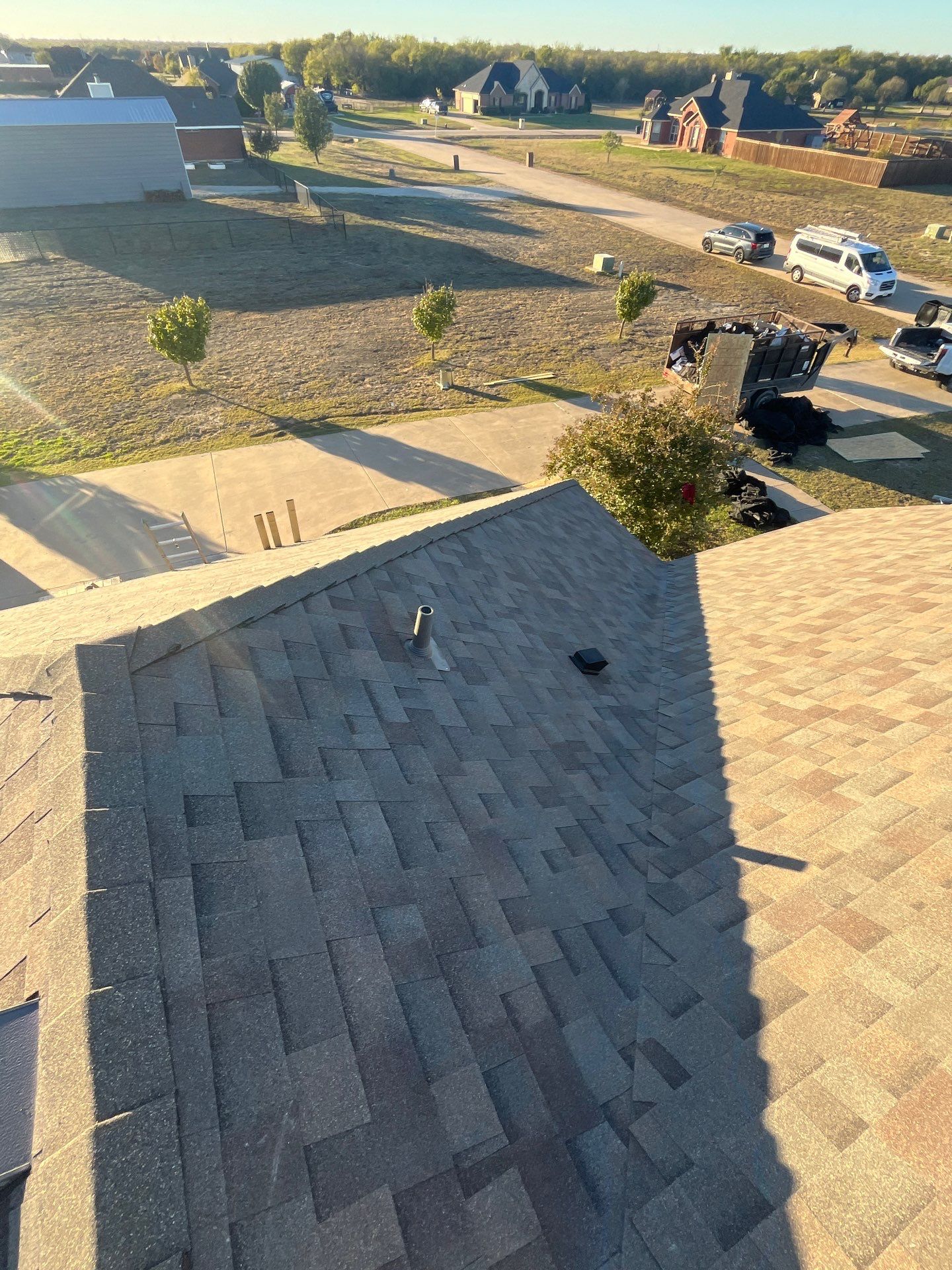 Brick with Malarkey Natural Wood by Tejas Roofworks + Restoration