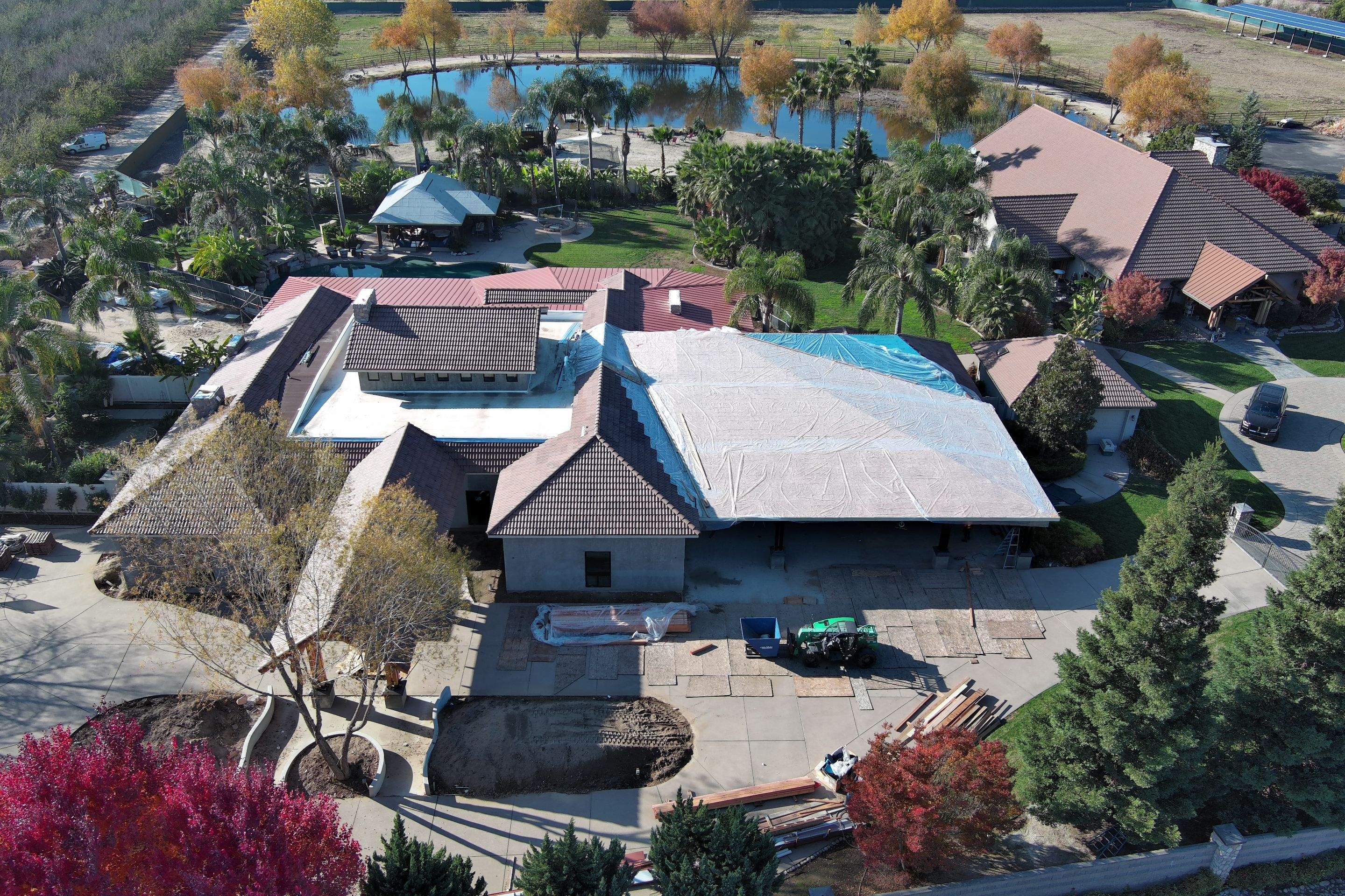 Tile, Metal, and TPO roofing project (new construction) by Straight Edge Roofing Inc