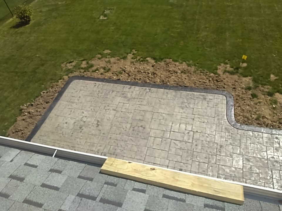 Stamped Concrete, Entry Door, and Concrete  by Ivy Lea Construction