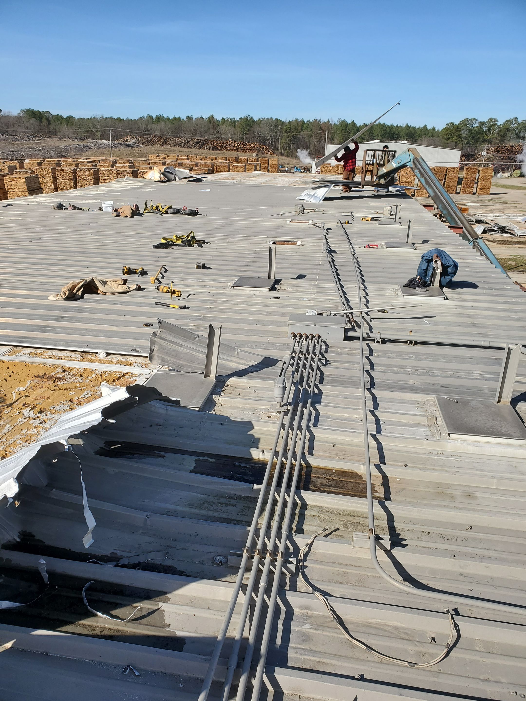 Commercial Roofing Installation using Aluminum Roofing panels by Hostetler Roofing