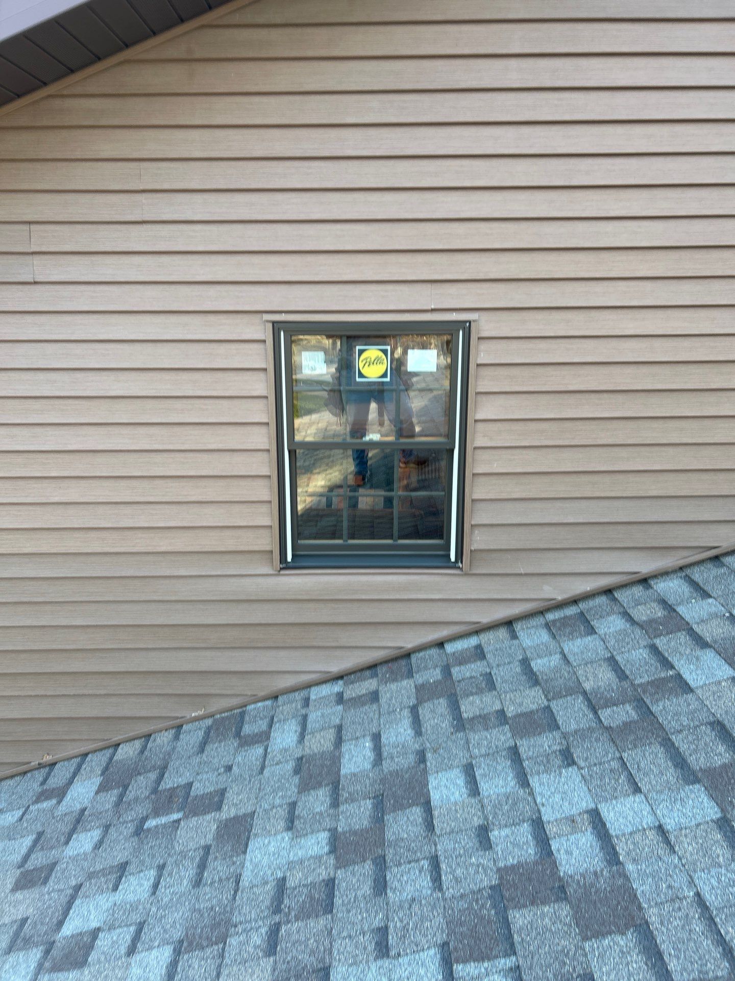 Pella Window installation using Pella Lifestyle wood/Aluminum window by United Windows and Siding LLC