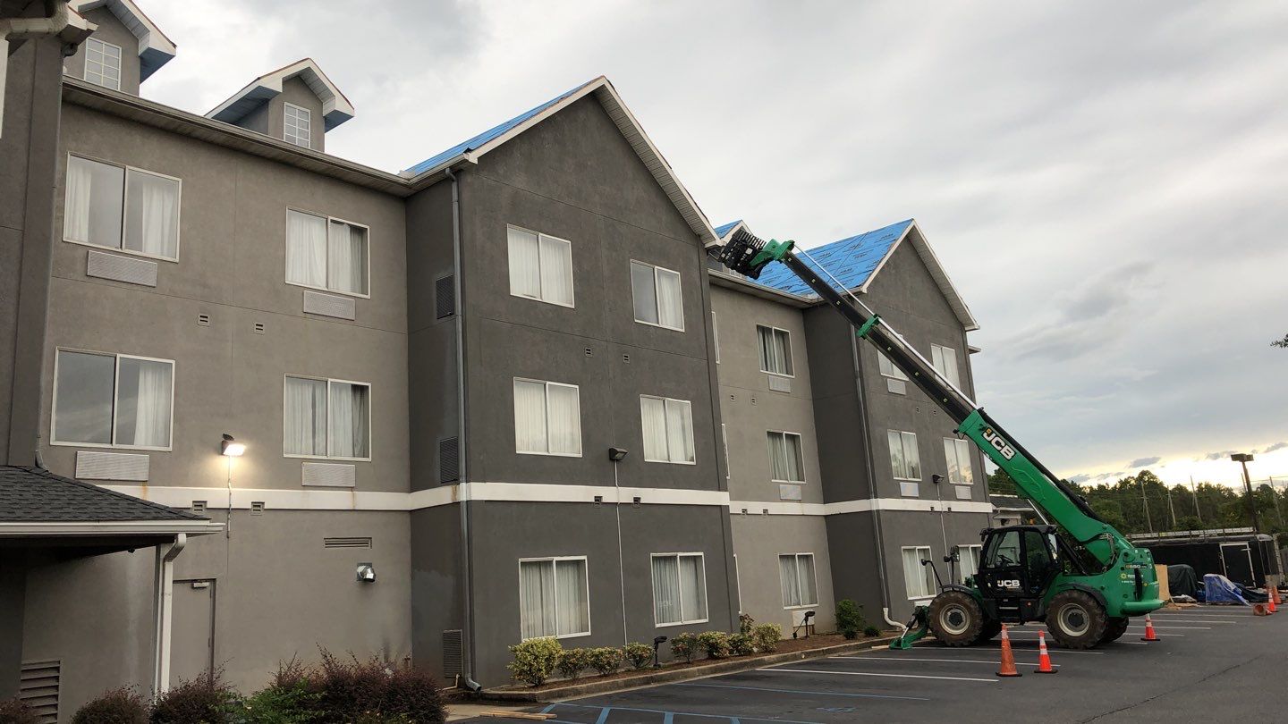 Commercial Roofing Installation using Roof Replacement by American Roofing & Construction LLC