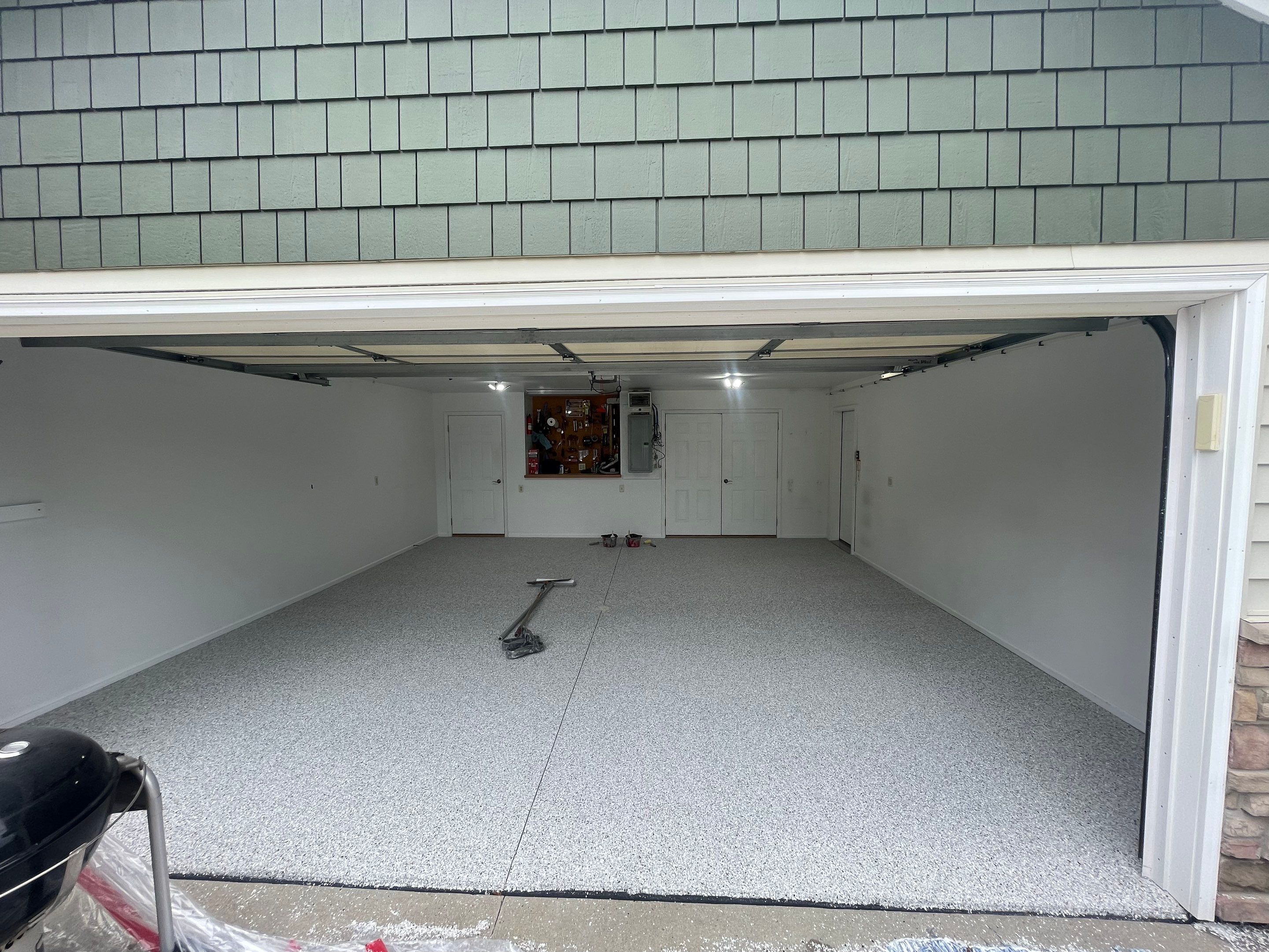 Coyote Flake Garage Floor Coating in Worthington, Minnesota by Select Painting, Coatings & Garage Cabinets