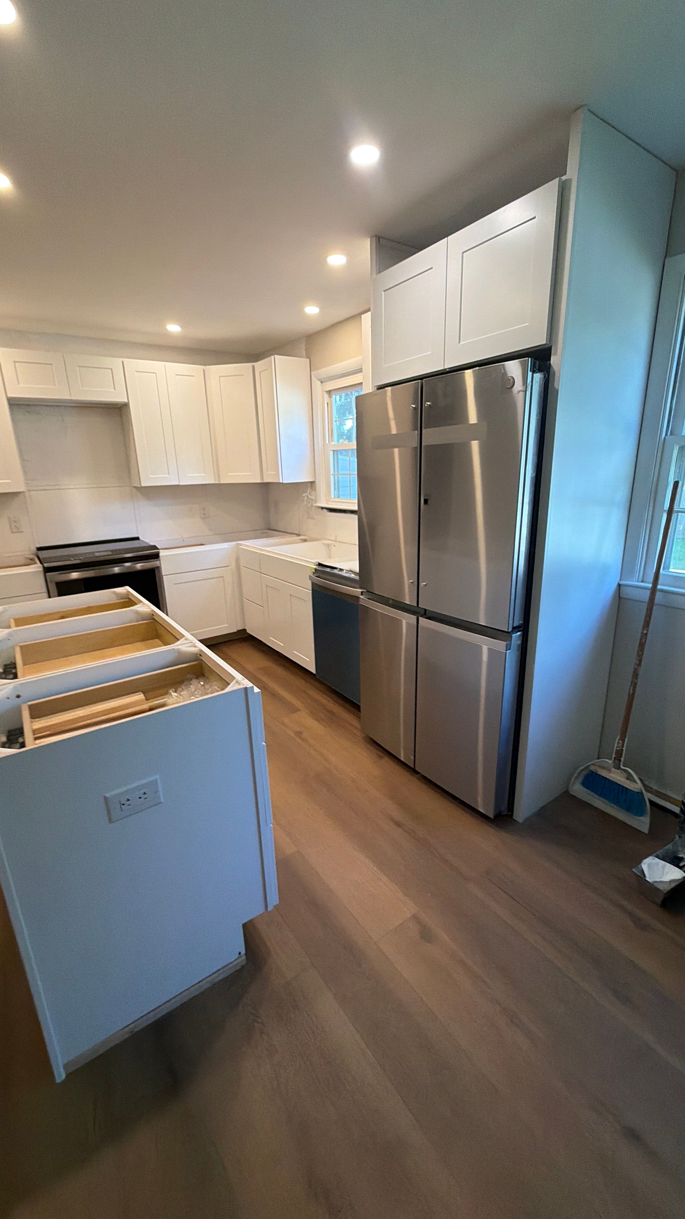Phoenixville Kitchen Remodel with White Shaker Cabinets and Green Backsplash by Reliable General Contracting