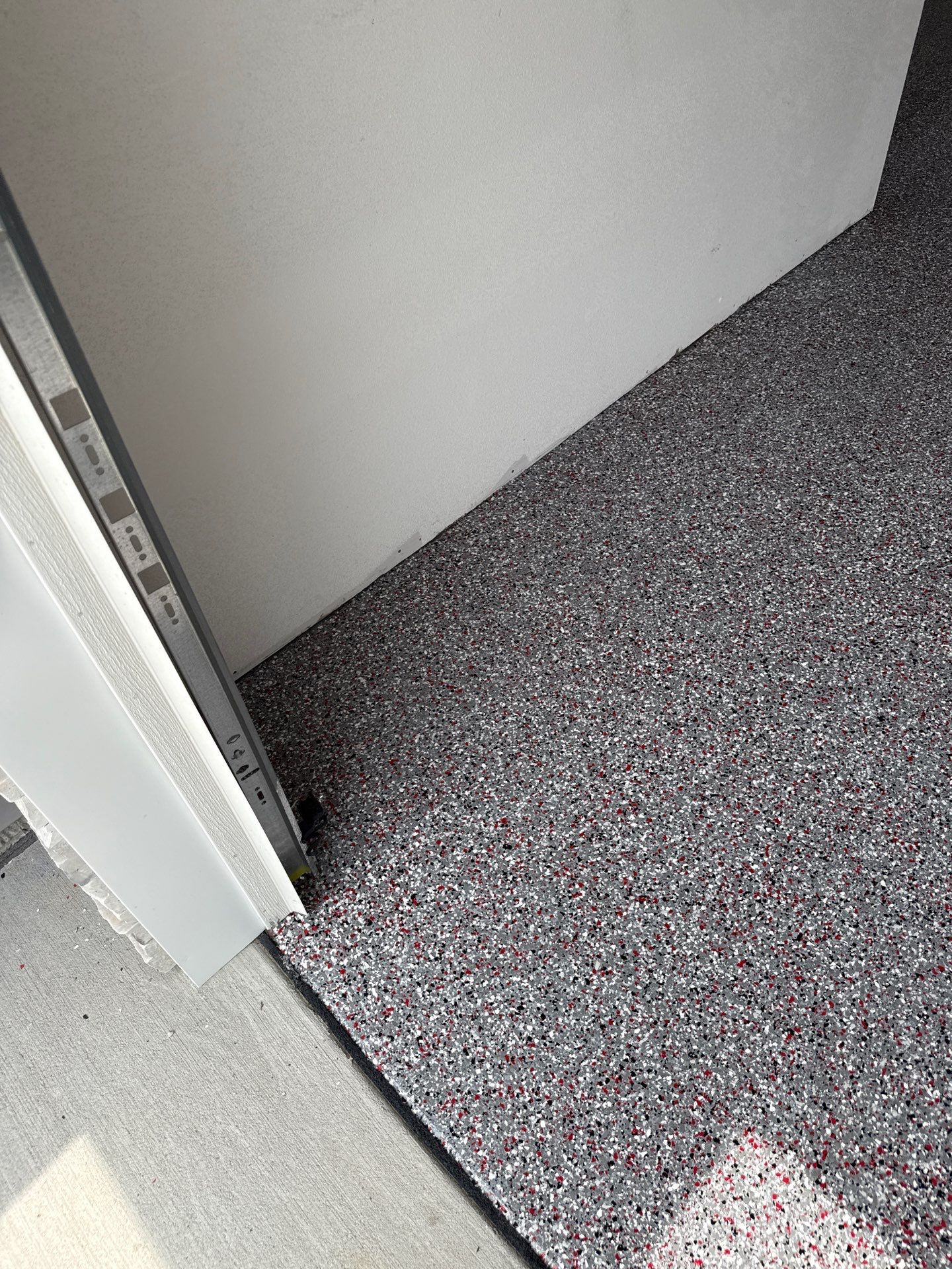 Custom Flake Garage Floor Coating Installation in Altoona by Revival Concrete Coatings